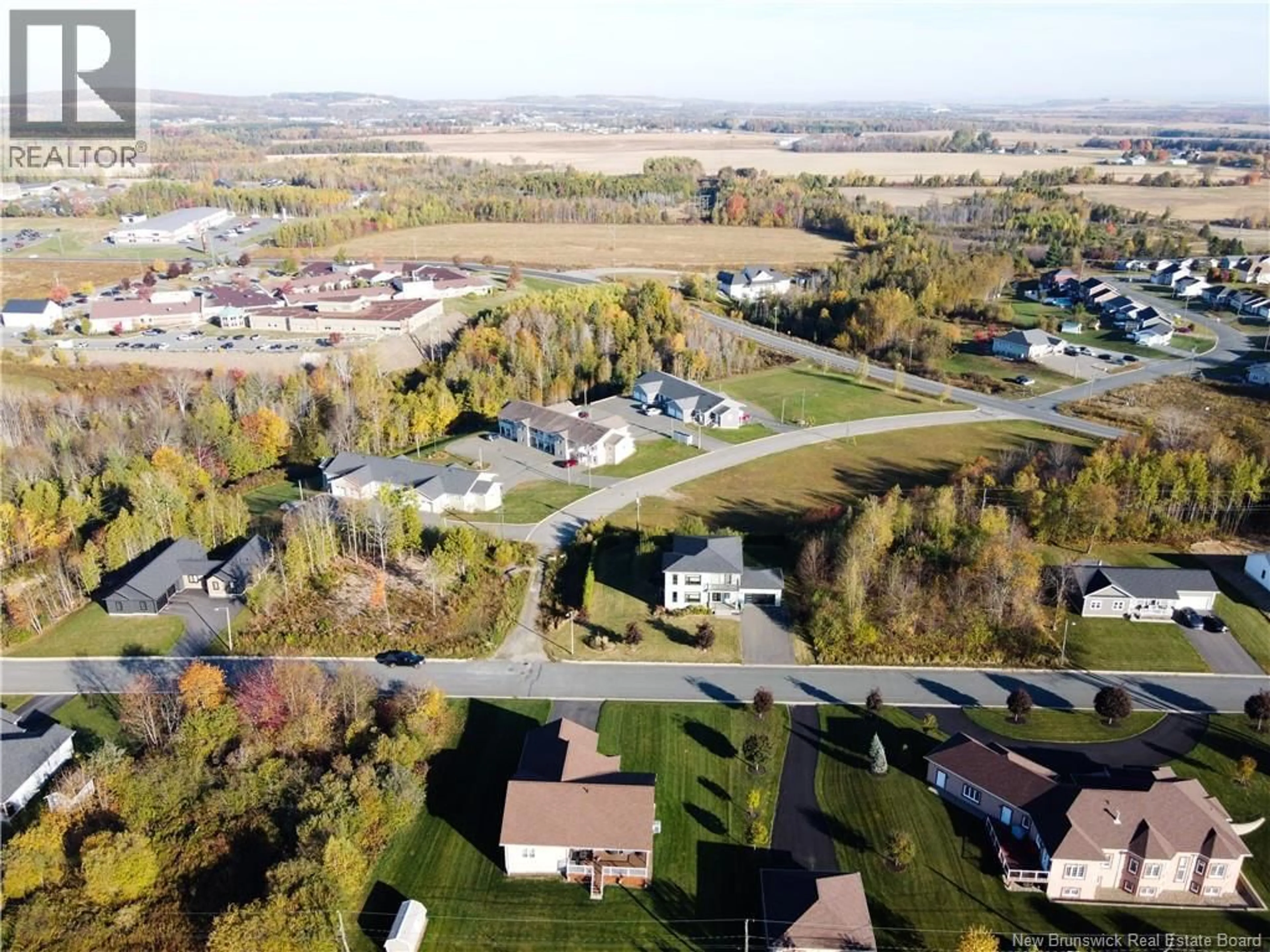A pic from outside/outdoor area/front of a property/back of a property/a pic from drone, street for 44 BICENTENNIAL DRIVE, Woodstock New Brunswick E7M6A7