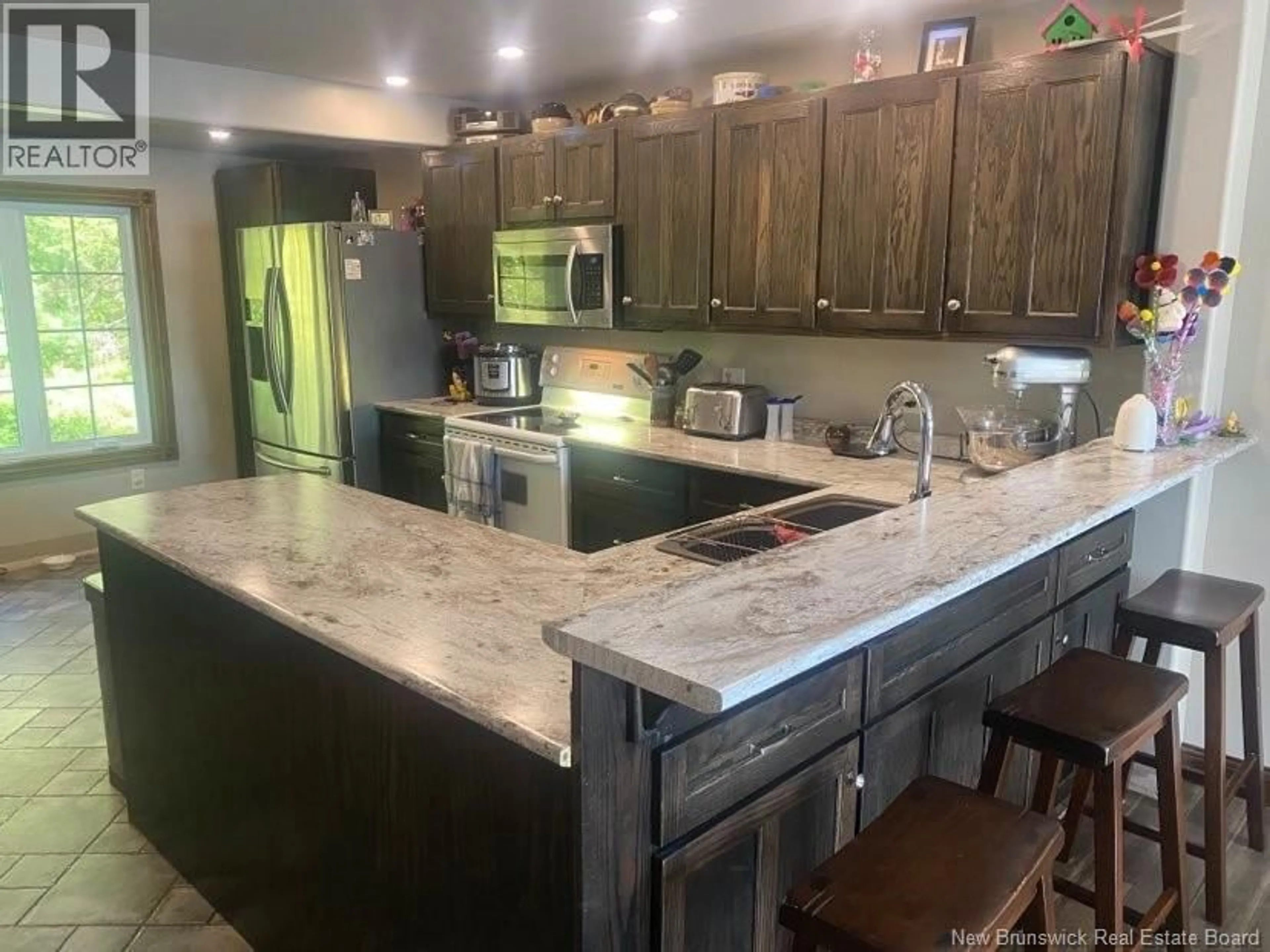 Open concept kitchen, ceramic/tile floor for 14 MORAN LANE, St. Stephen New Brunswick E3L3R4