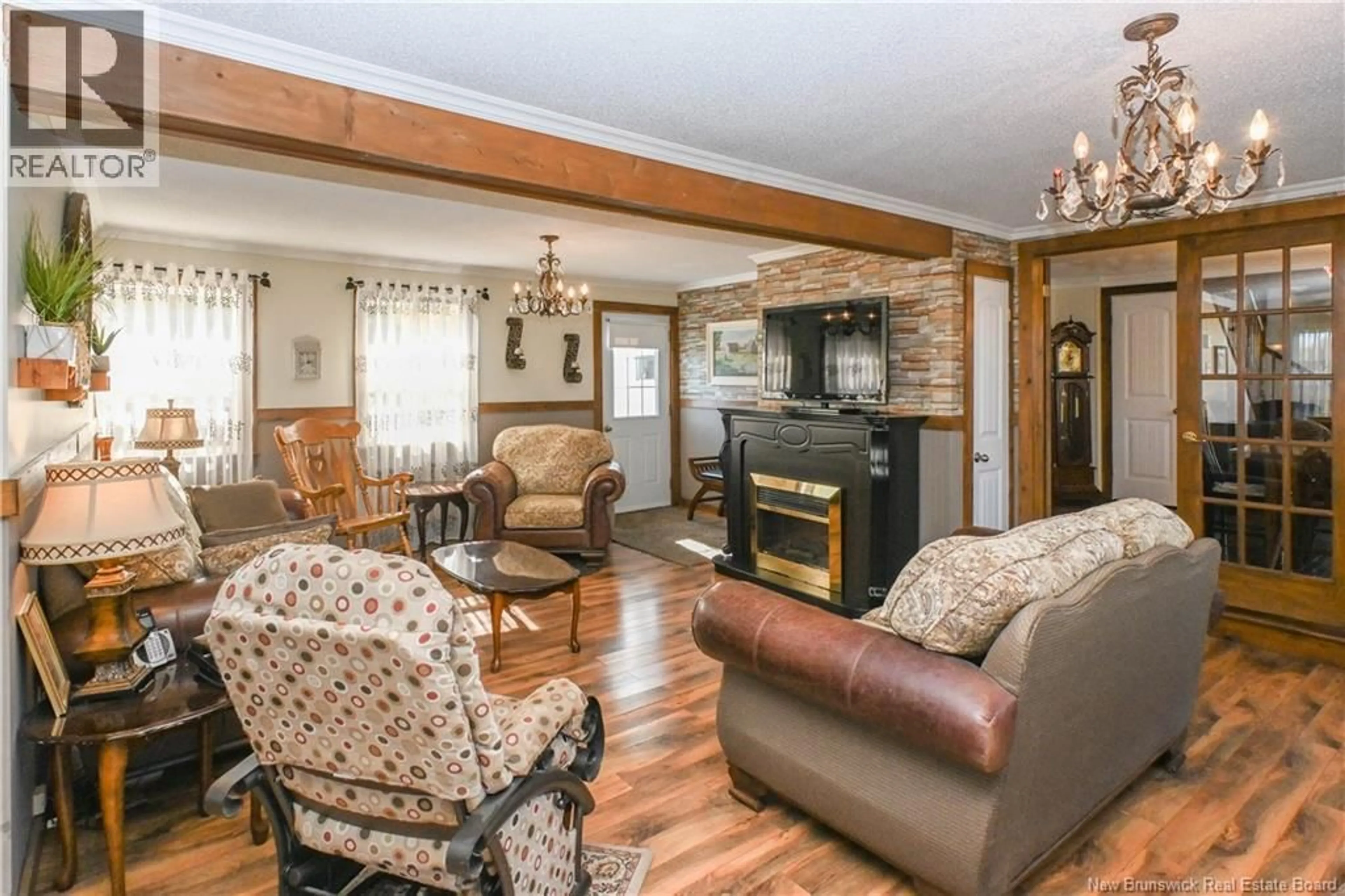 Living room with furniture, wood/laminate floor for 1434 355 ROUTE, Sainte-Rose New Brunswick E1X2X2