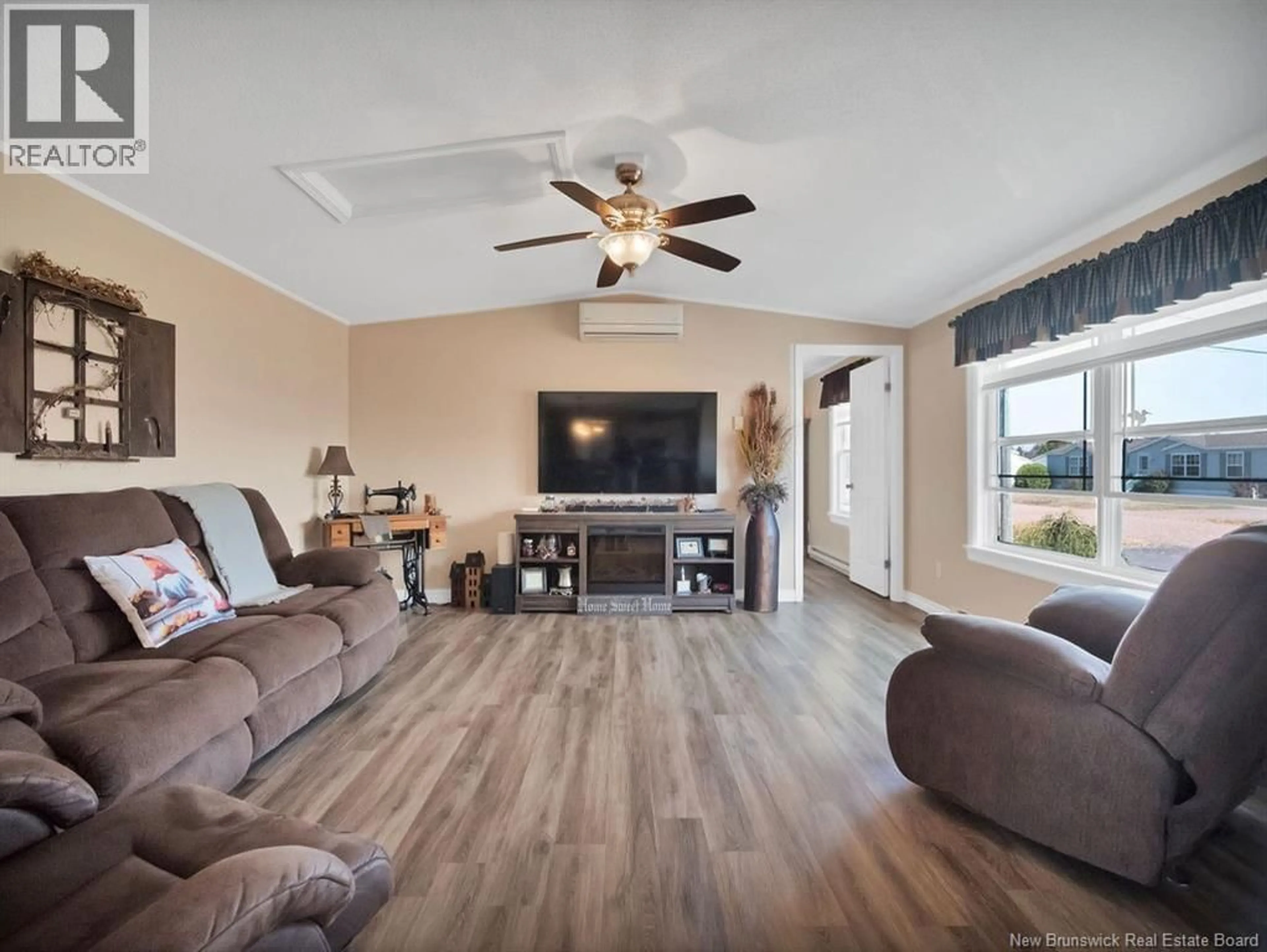 Living room with furniture, wood/laminate floor for 7 ASCONA STREET, Moncton New Brunswick E1H3H7