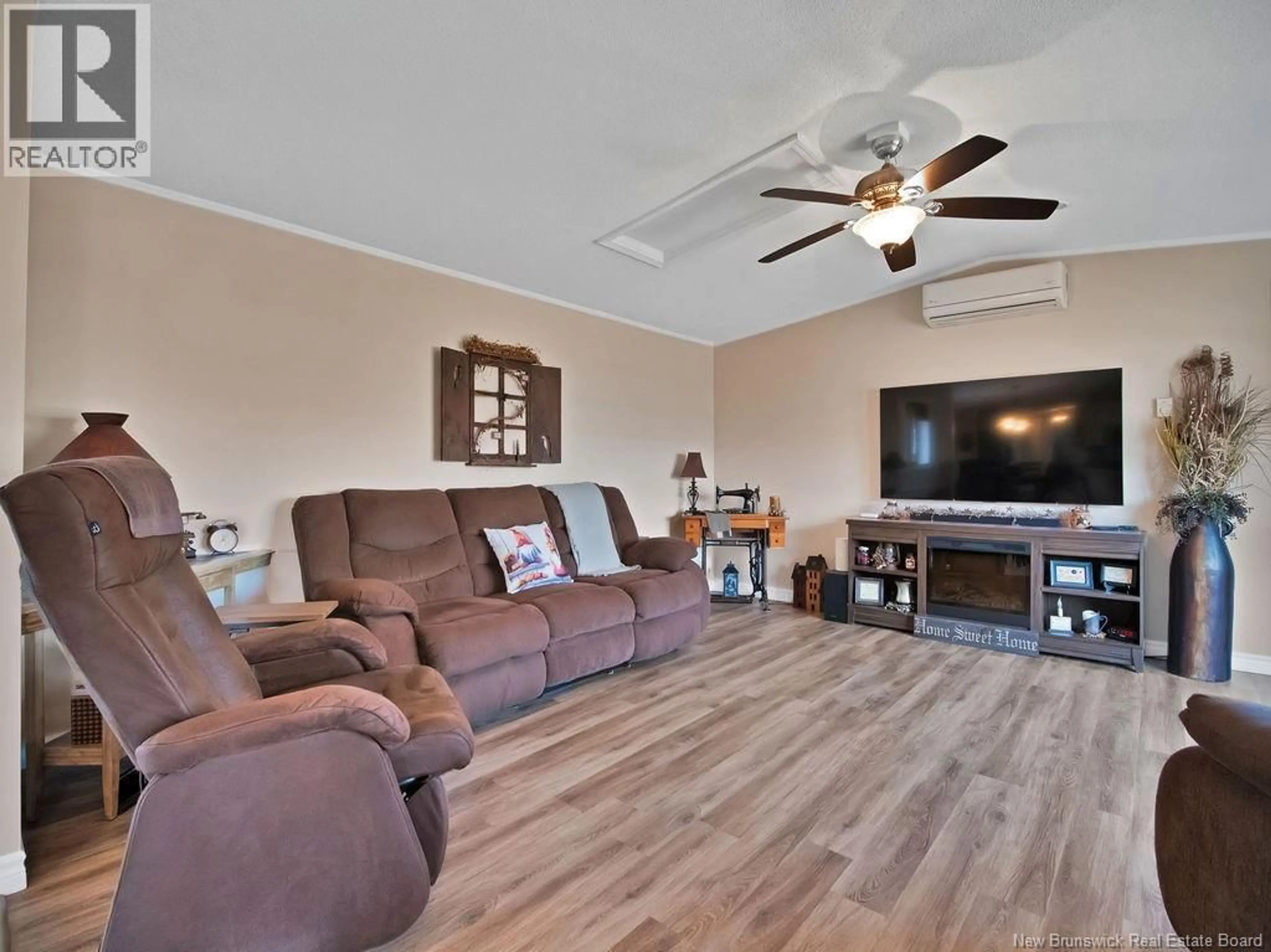 Living room with furniture, wood/laminate floor for 7 ASCONA STREET, Moncton New Brunswick E1H3H7