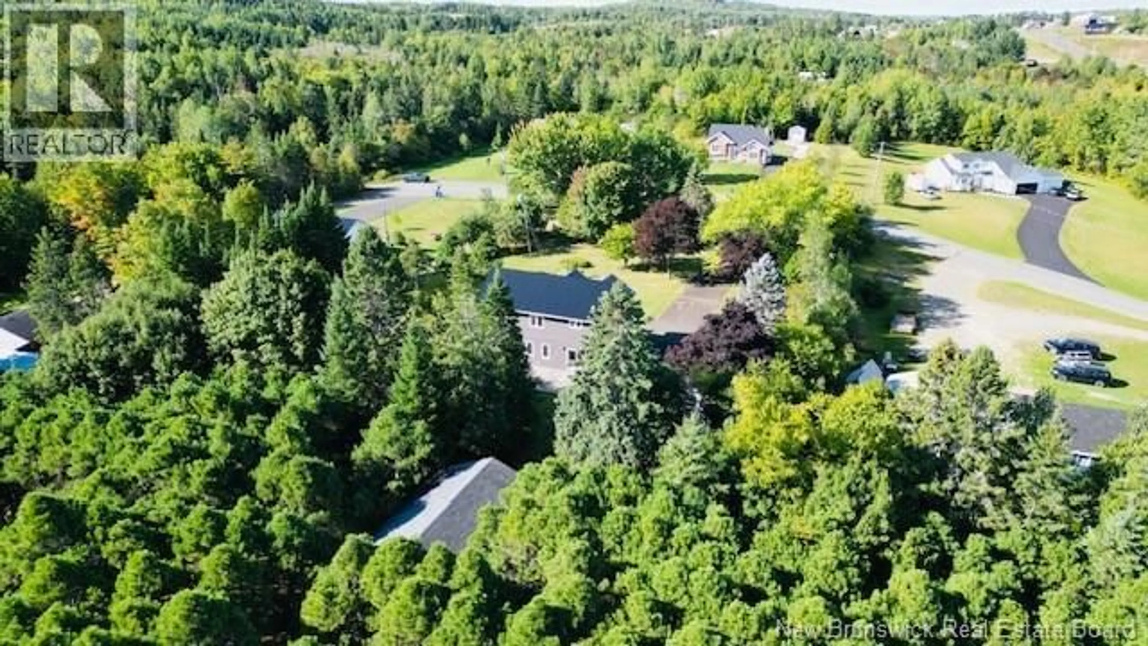 A pic from outside/outdoor area/front of a property/back of a property/a pic from drone, forest/trees view for 40 LEPAGE STREET, Balmoral New Brunswick E8E1J2