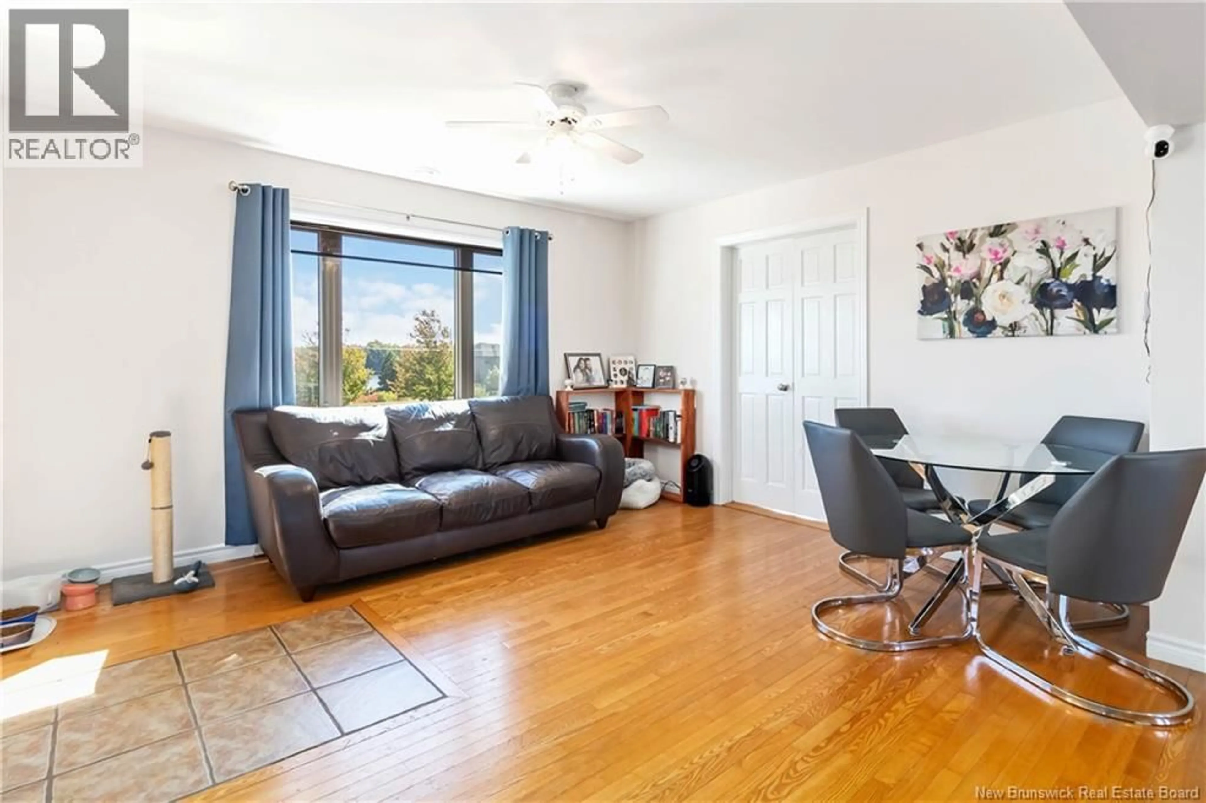 Living room with furniture, wood/laminate floor for 18 HERITAGE, Bouctouche New Brunswick E4S0G1