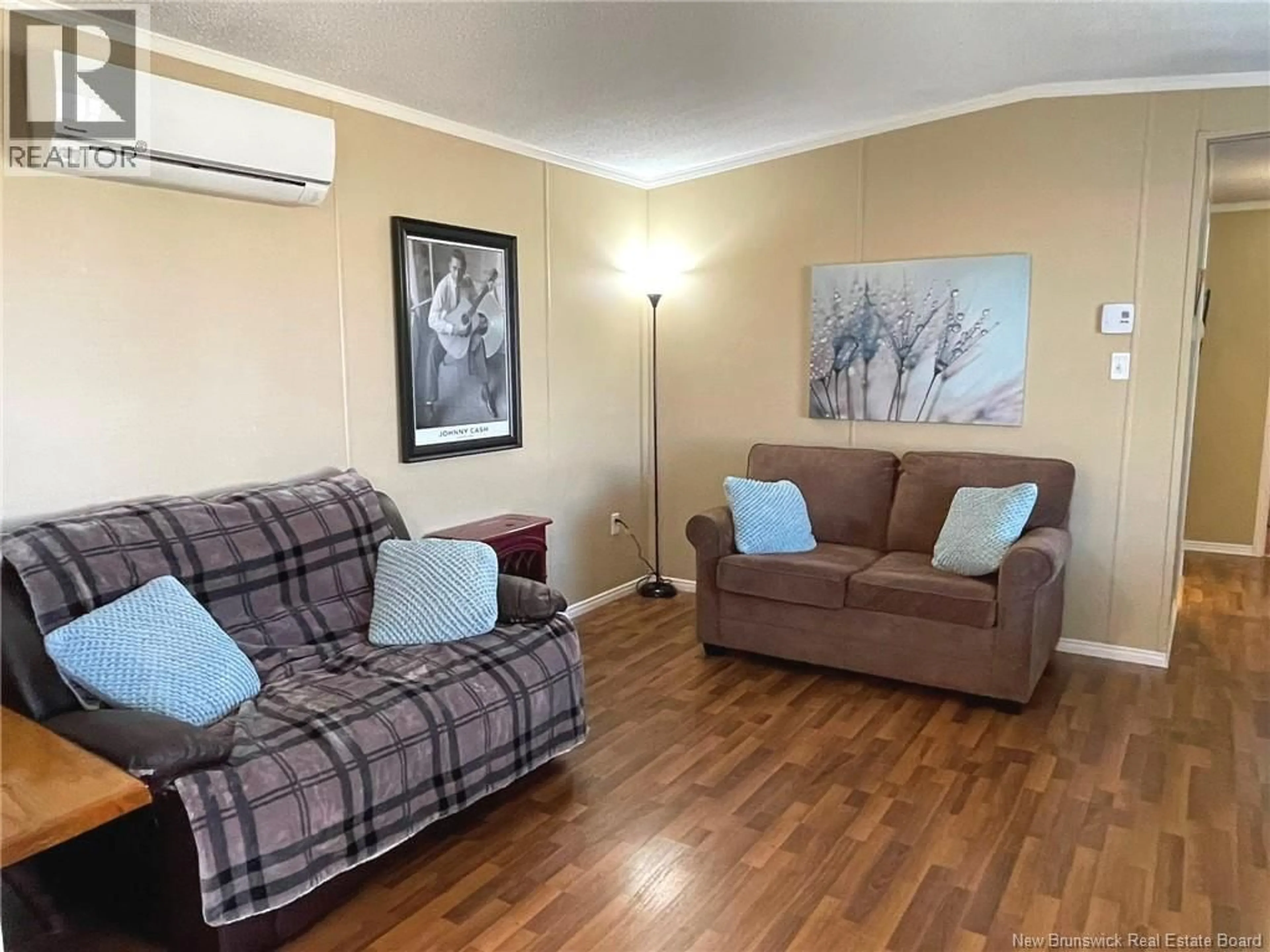Living room with furniture, wood/laminate floor for 51 TRACADIE DRIVE, Dieppe New Brunswick E1A8P3