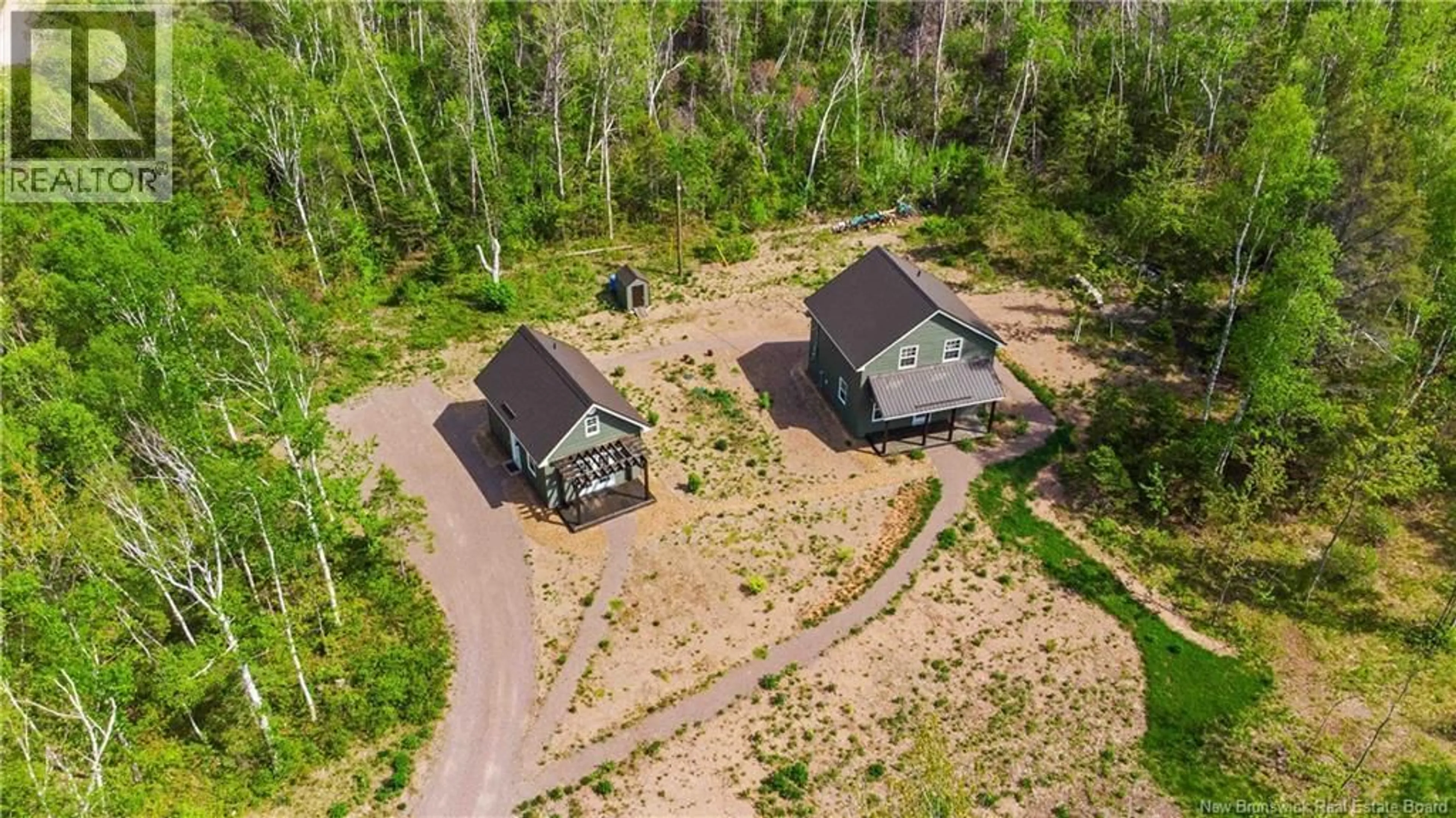 A pic from outside/outdoor area/front of a property/back of a property/a pic from drone, forest/trees view for 33 BARON ROAD, Barachois New Brunswick E4P9A6