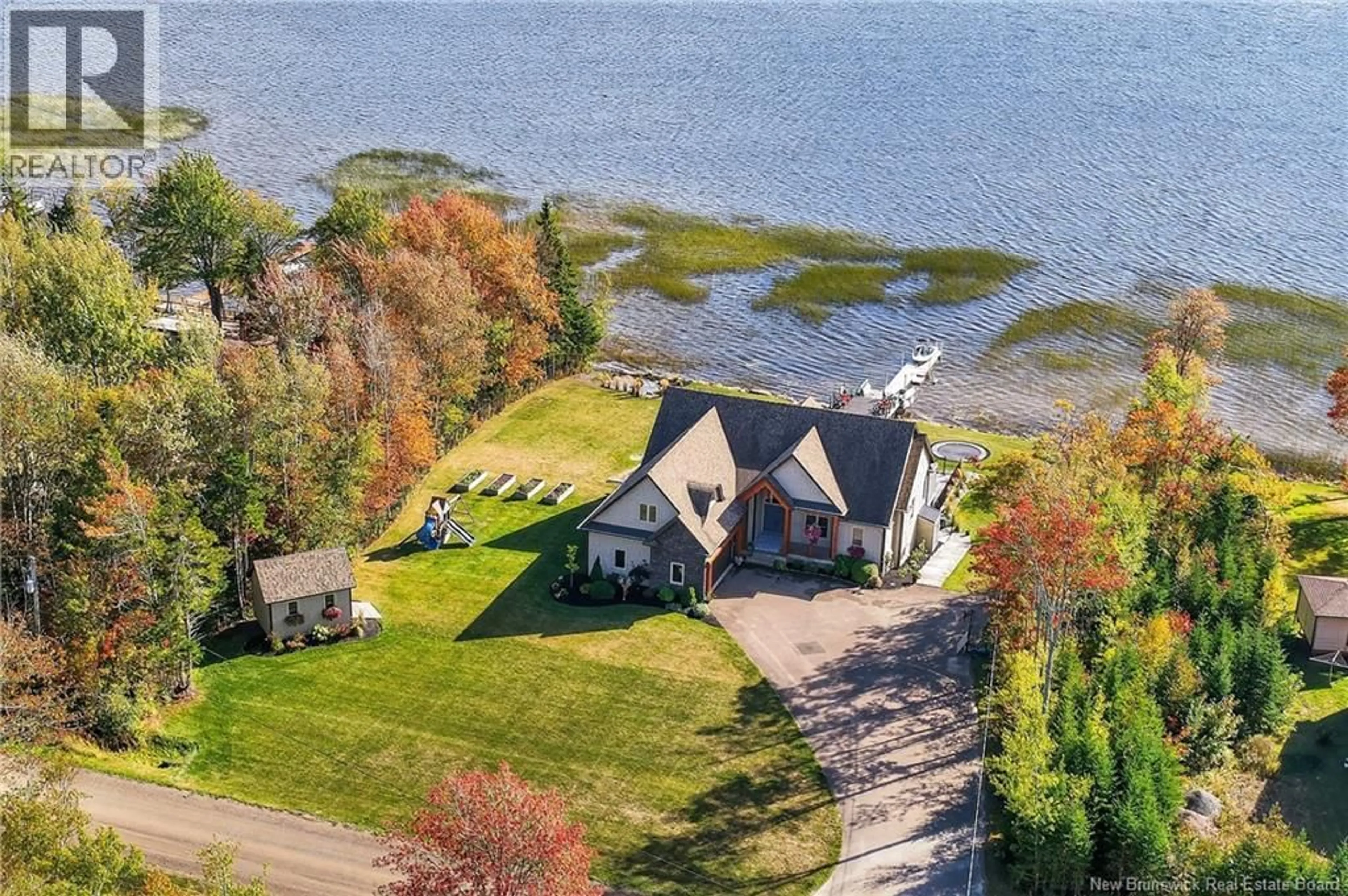 A pic from outside/outdoor area/front of a property/back of a property/a pic from drone, water/lake/river/ocean view for 430 SQUARE LAKE, Saint-Andre-LeBlanc New Brunswick E4P6G8