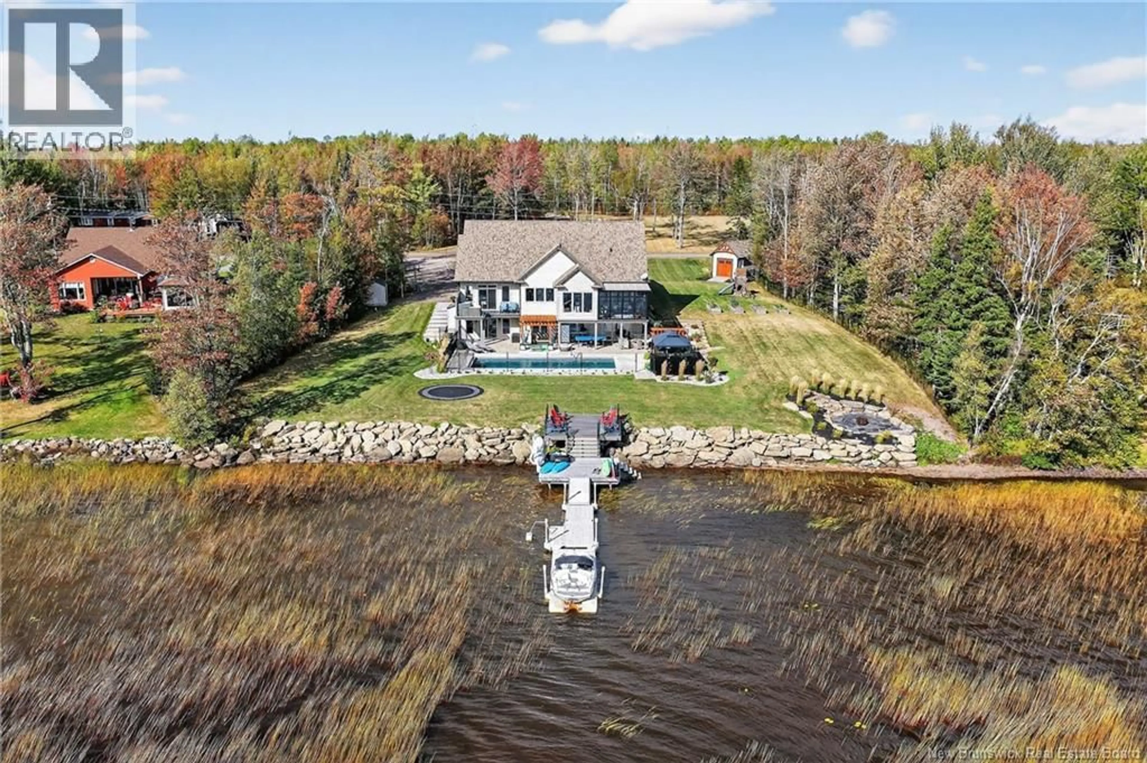 A pic from outside/outdoor area/front of a property/back of a property/a pic from drone, water/lake/river/ocean view for 430 SQUARE LAKE, Saint-Andre-LeBlanc New Brunswick E4P6G8