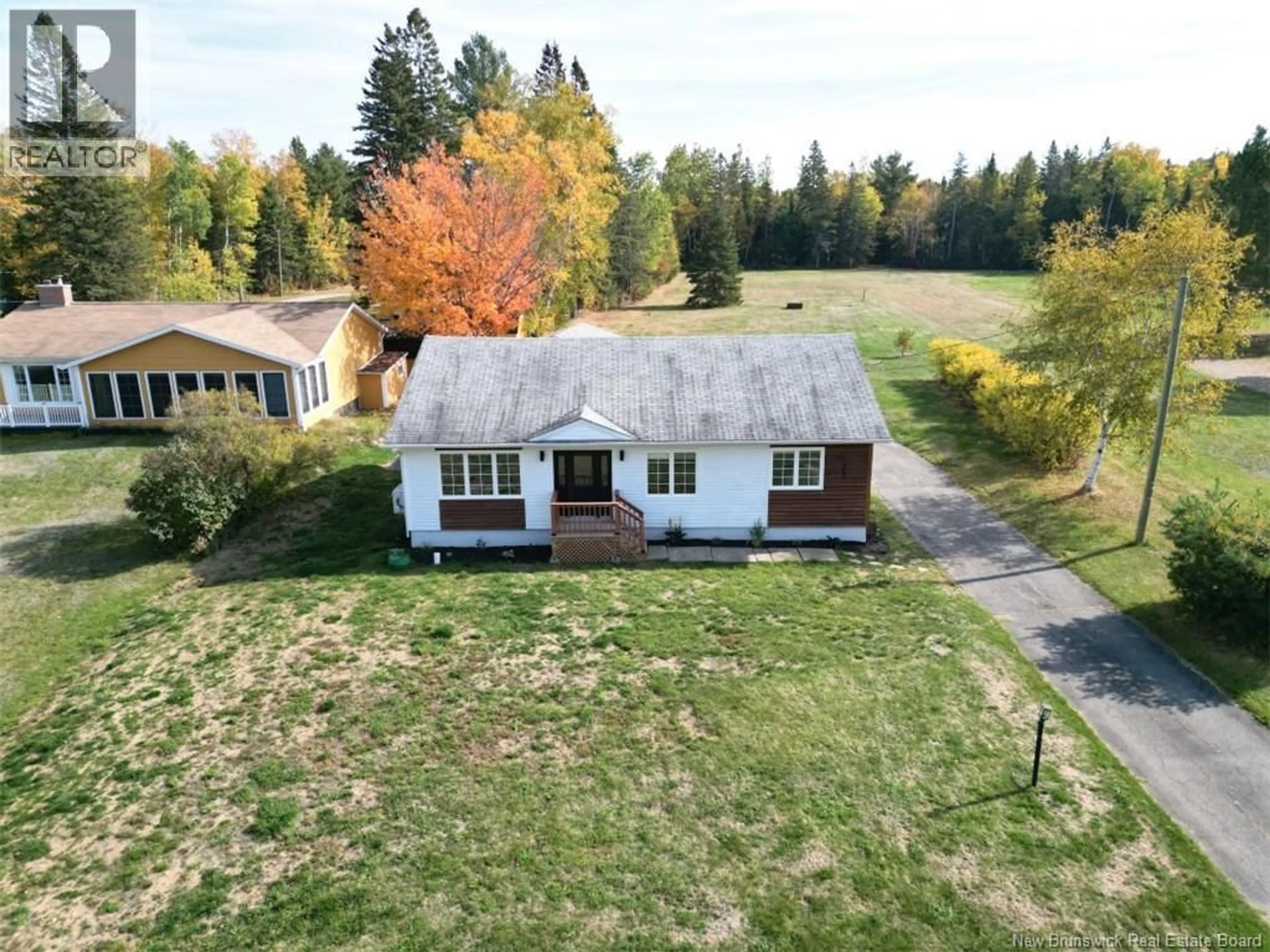 A pic from outside/outdoor area/front of a property/back of a property/a pic from drone, unknown for 1990 CARRON, Bathurst New Brunswick E2A5Z8