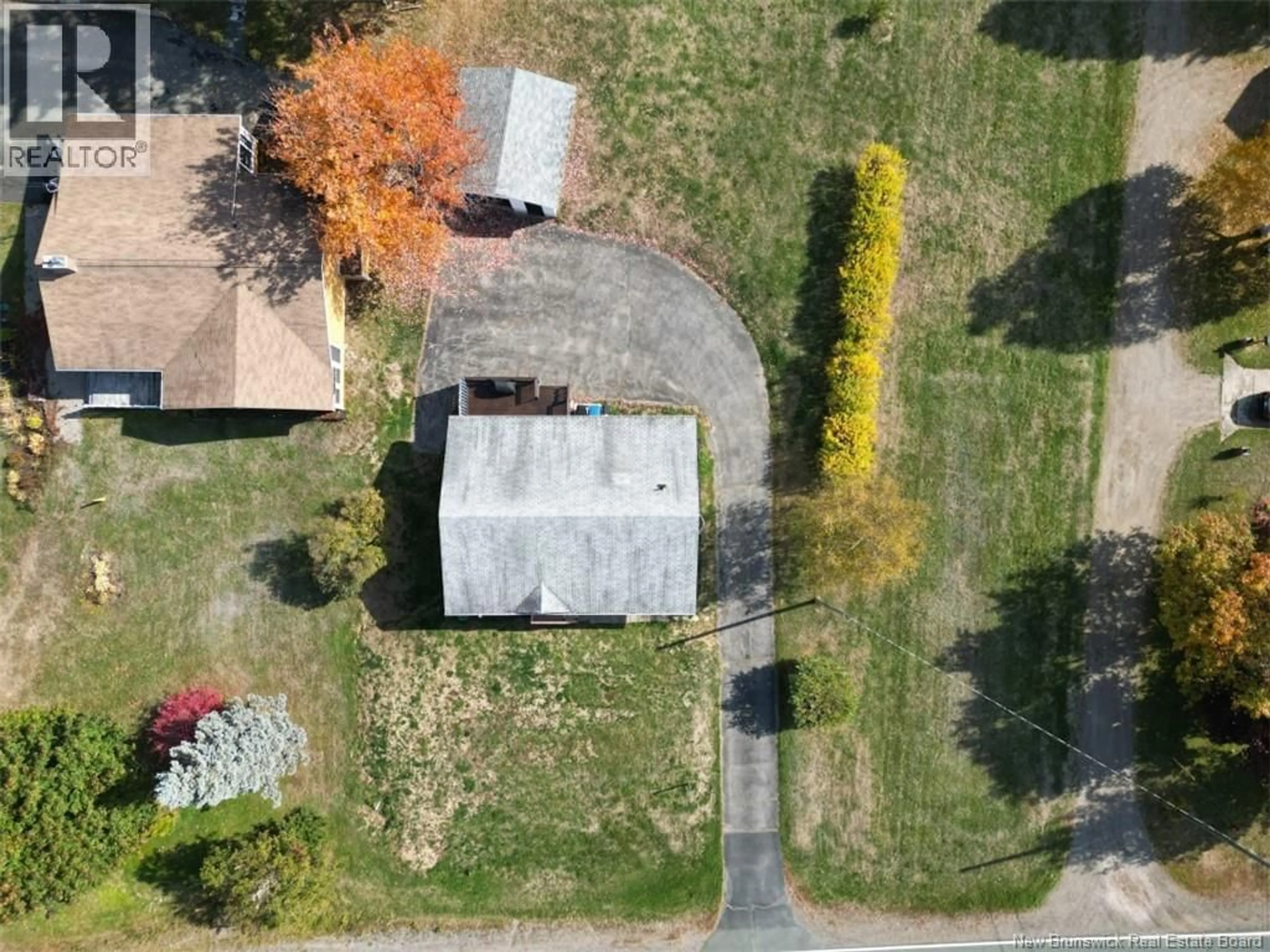 A pic from outside/outdoor area/front of a property/back of a property/a pic from drone, street for 1990 CARRON, Bathurst New Brunswick E2A5Z8