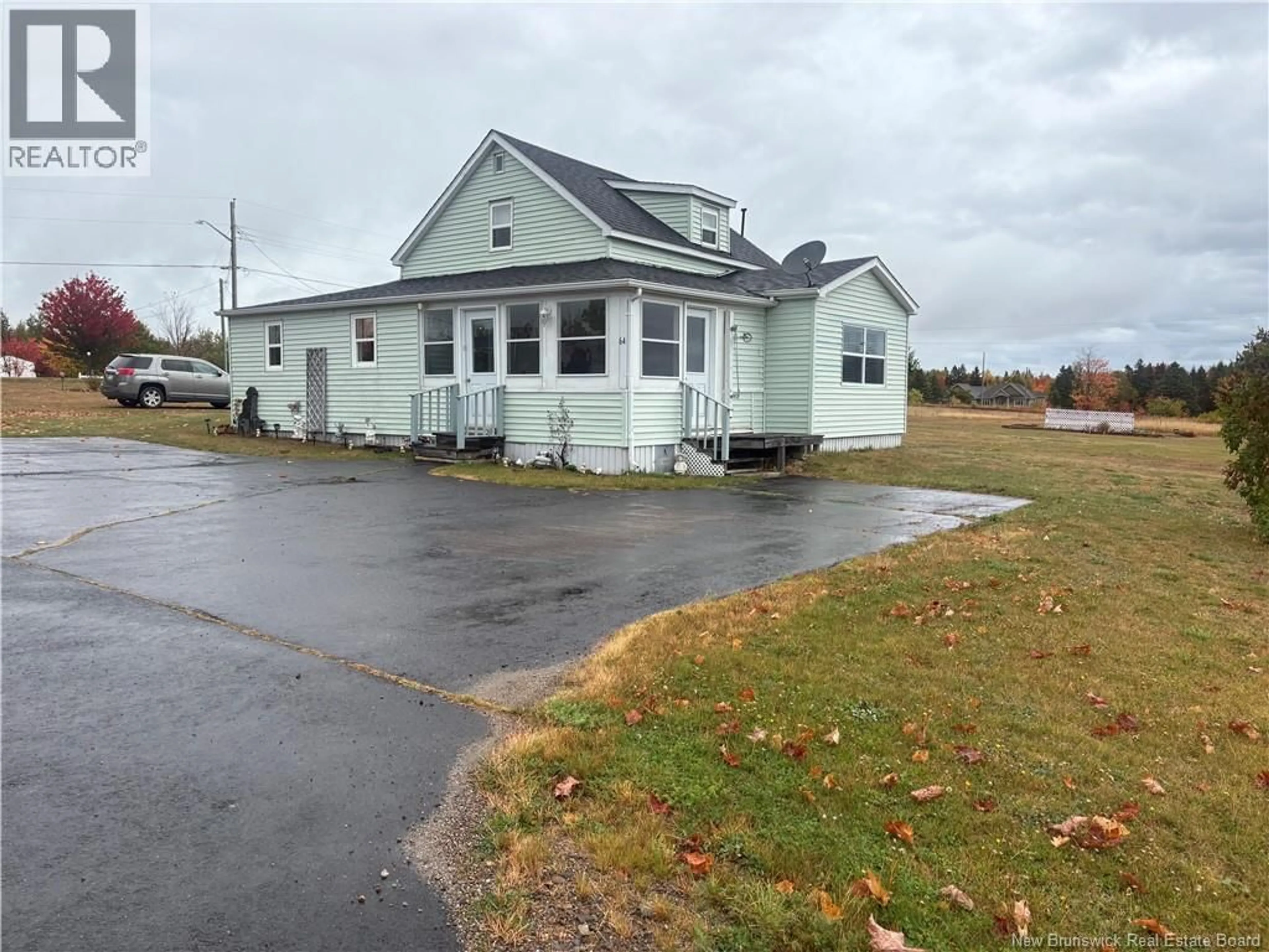 A pic from outside/outdoor area/front of a property/back of a property/a pic from drone, street for 64 LIONEL ROUTE, Neguac New Brunswick E9G1K3