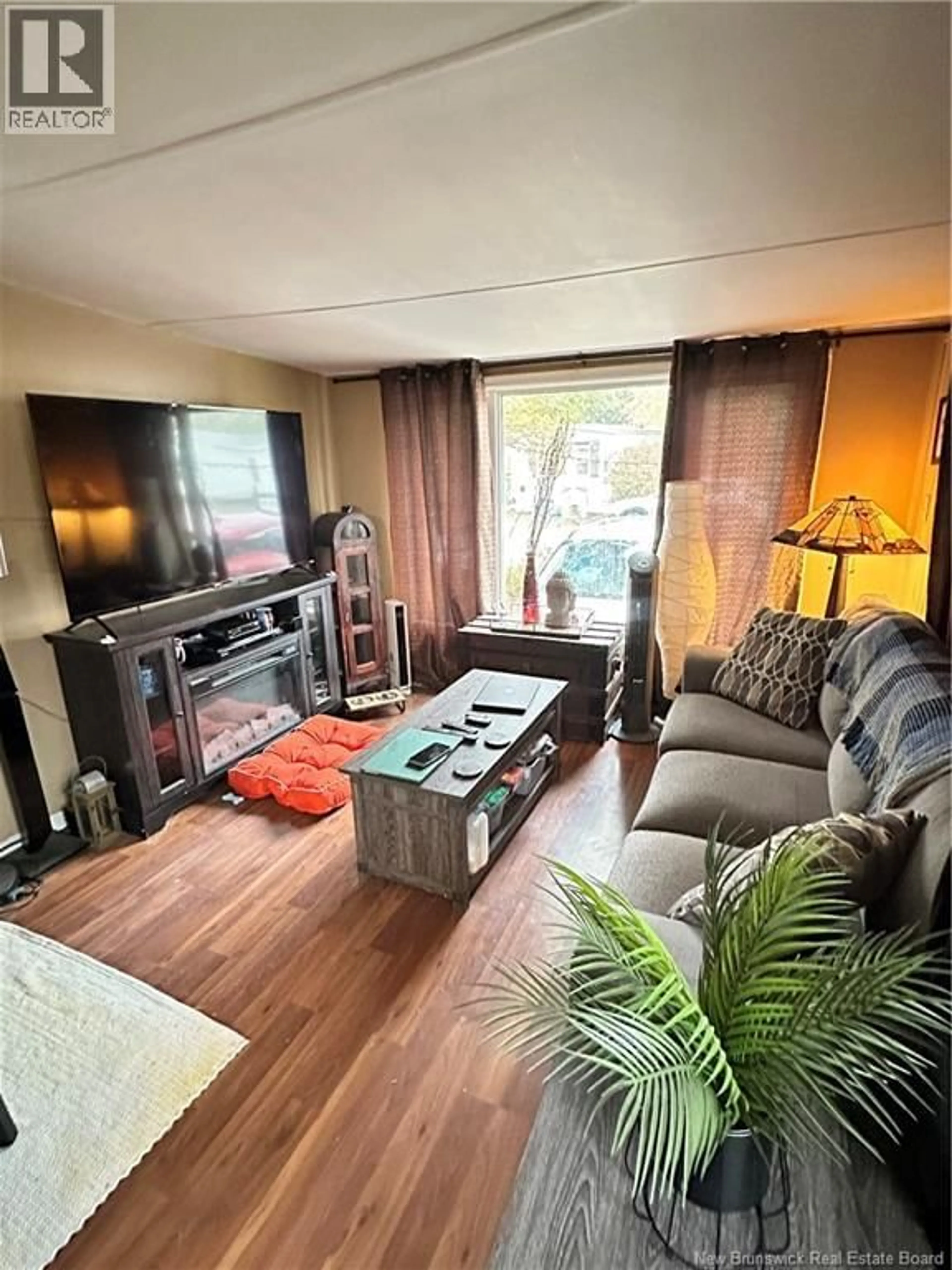 Living room with furniture, wood/laminate floor for 12 MIDWAY DRIVE, Moncton New Brunswick E1E2J5