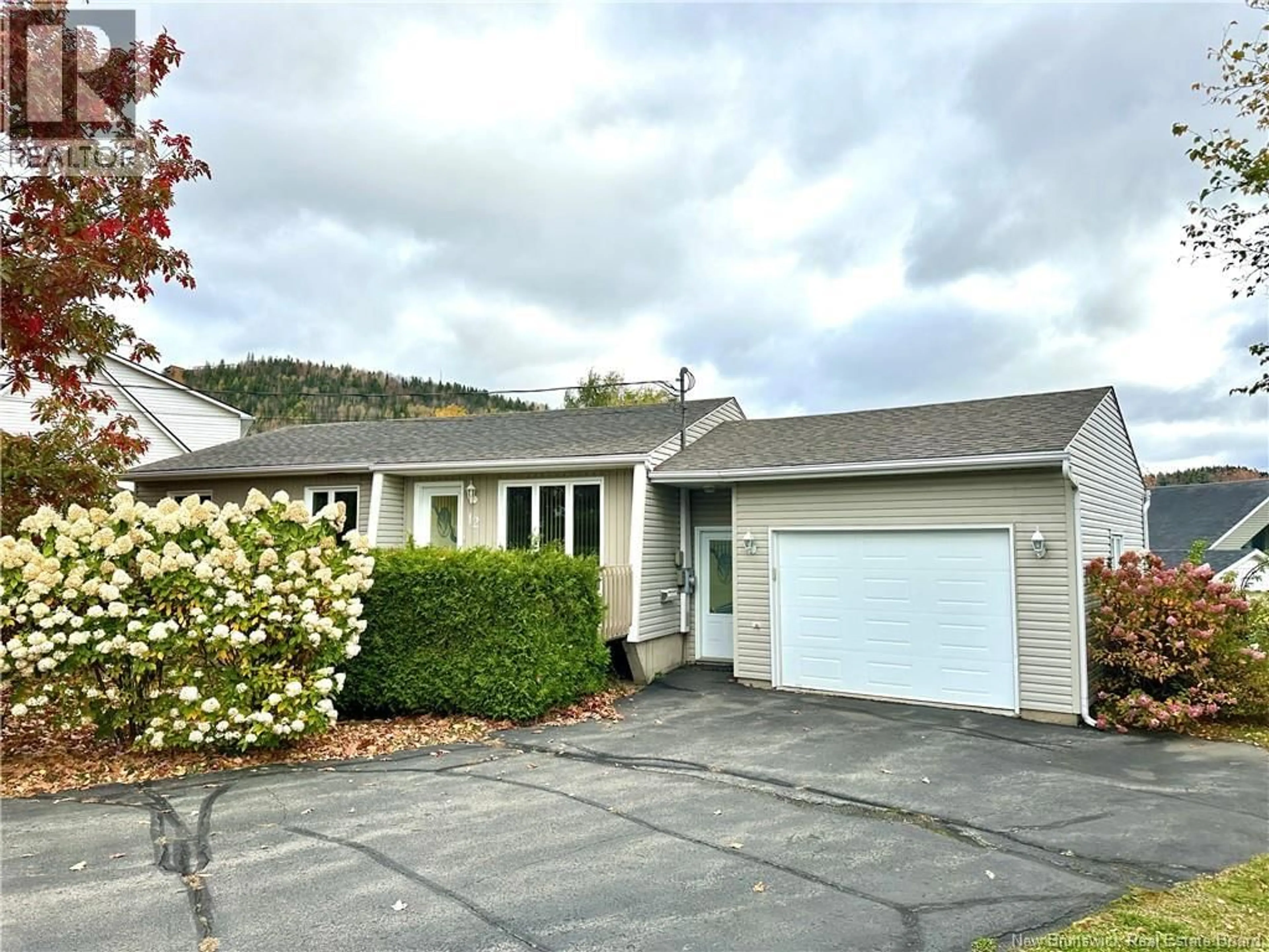 Home with vinyl exterior material, street for 12 LILIANNE AVENUE, Edmundston New Brunswick E3V3Z1
