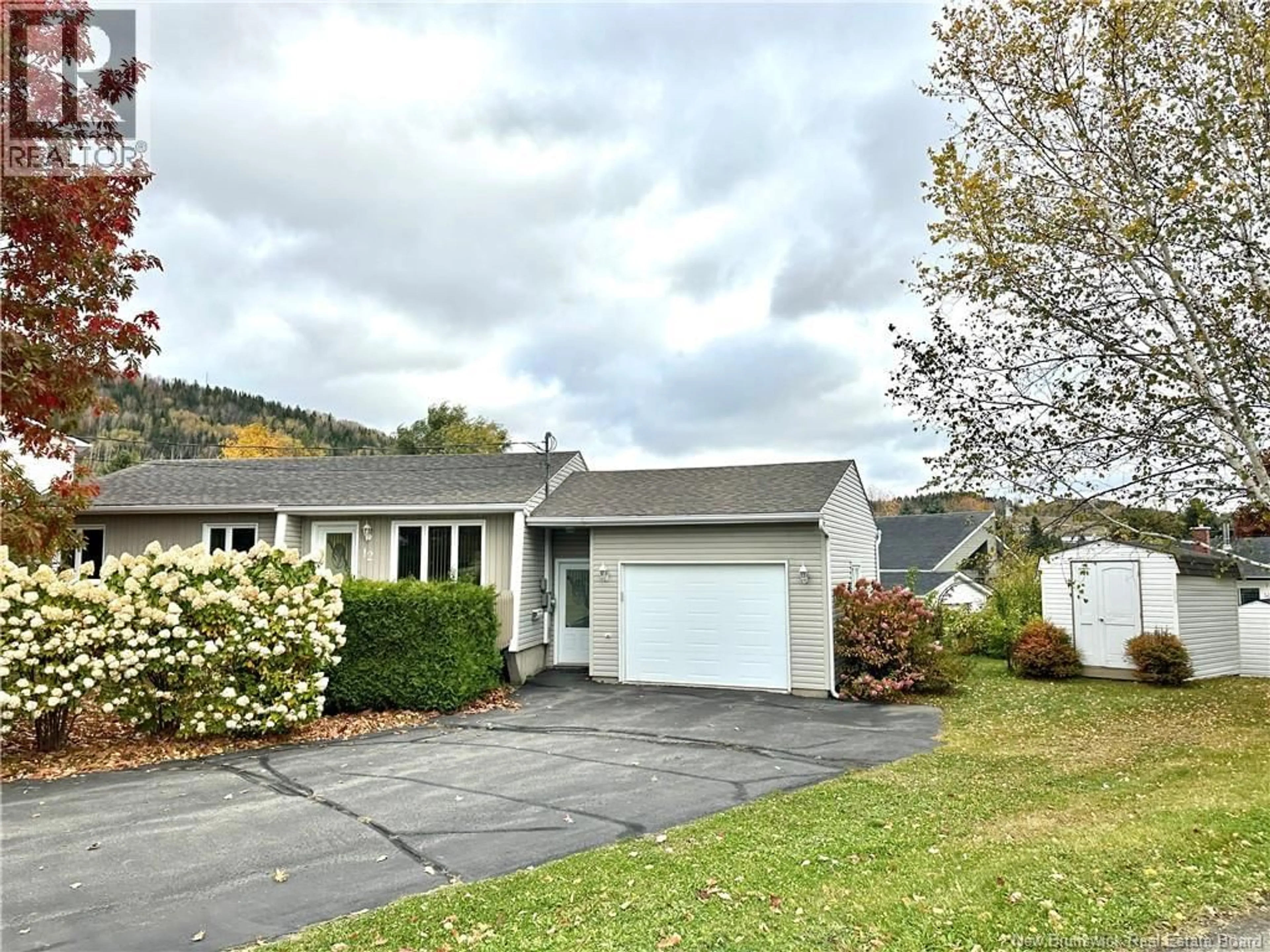 Home with vinyl exterior material, street for 12 LILIANNE AVENUE, Edmundston New Brunswick E3V3Z1