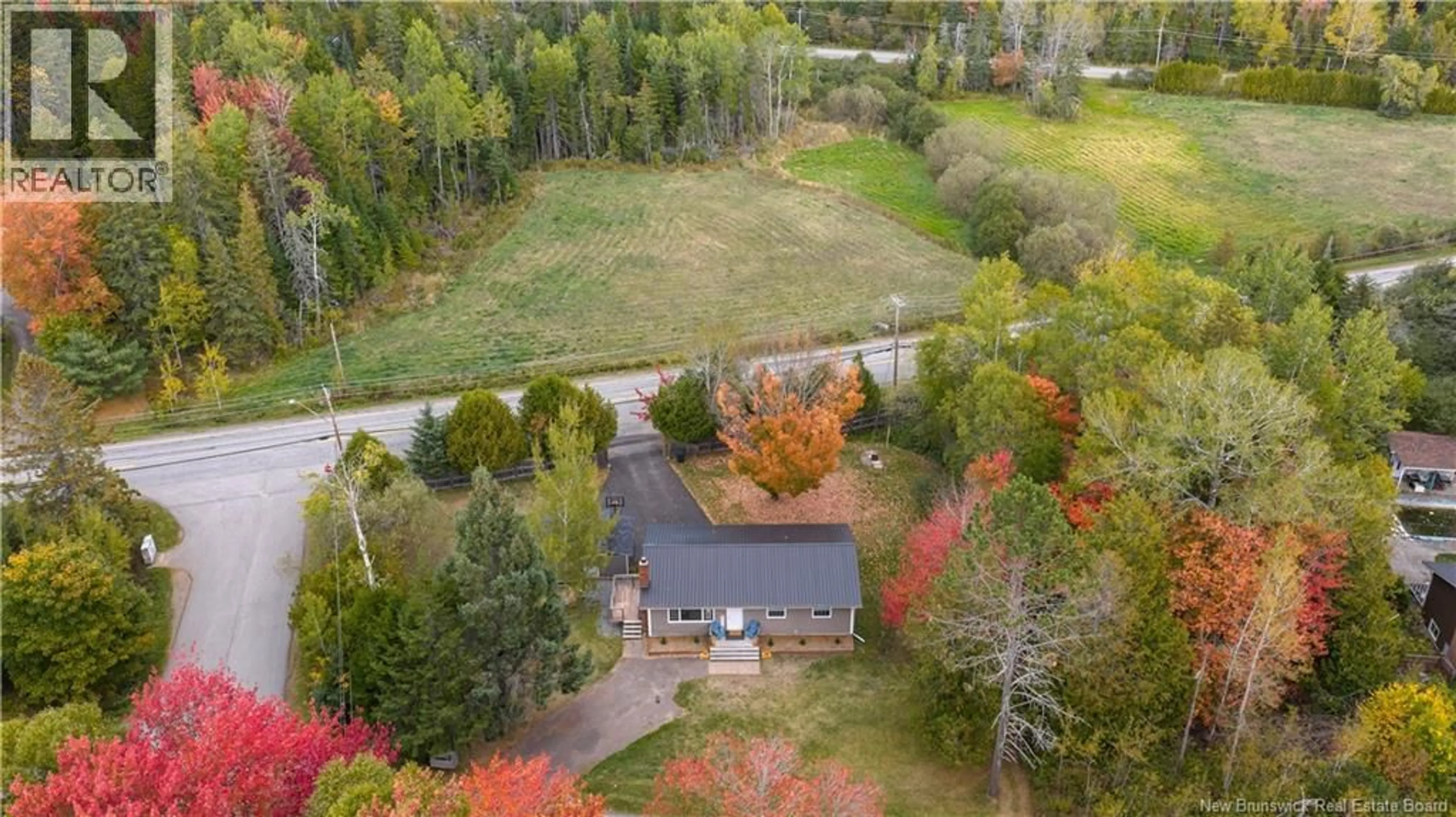 A pic from outside/outdoor area/front of a property/back of a property/a pic from drone, forest/trees view for 1 WOODRIDGE DRIVE, Quispamsis New Brunswick E2G1A2