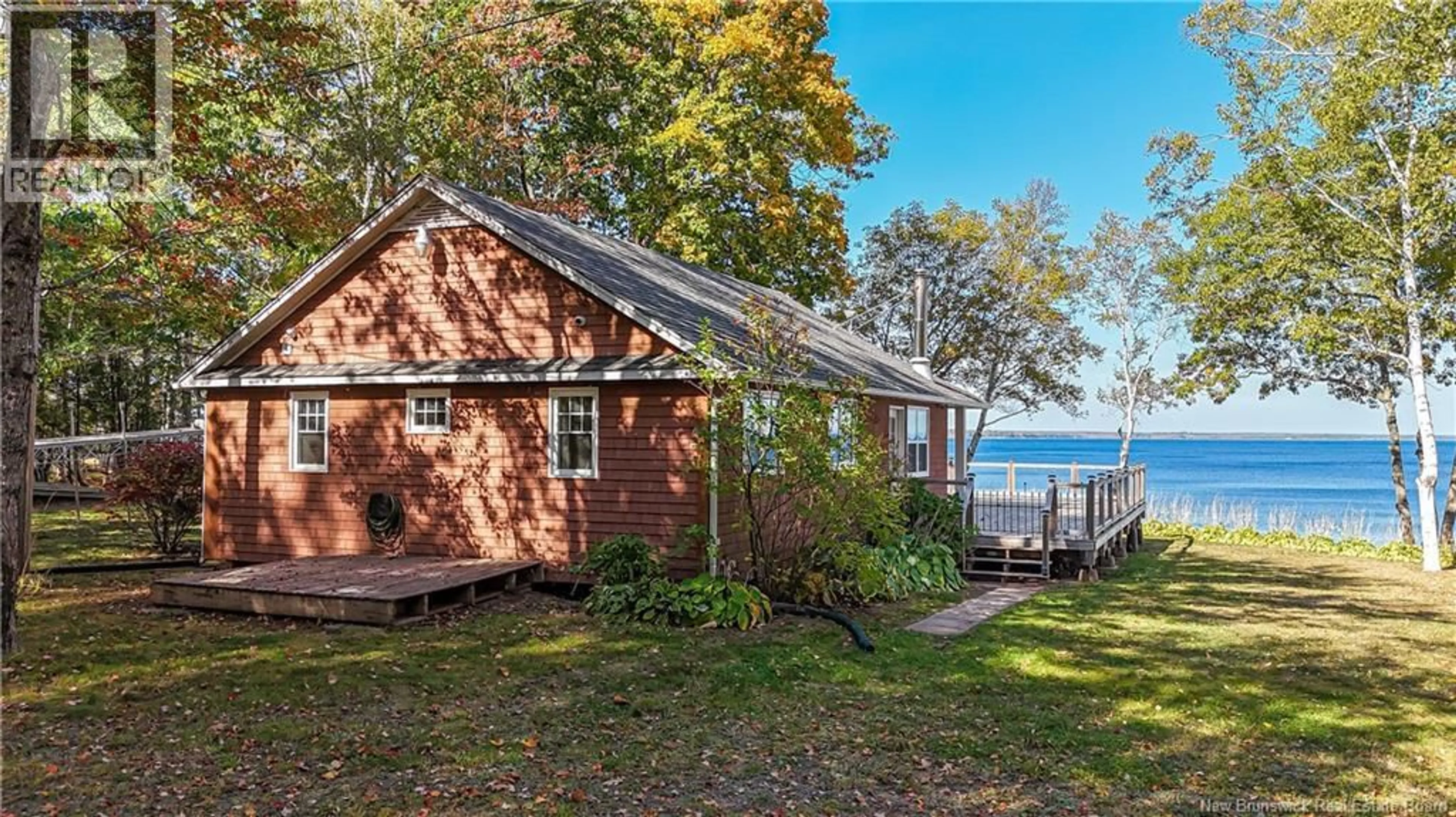 A pic from outside/outdoor area/front of a property/back of a property/a pic from drone, water/lake/river/ocean view for 63 LEWIS ROAD, Grand Lake New Brunswick E4C3V3