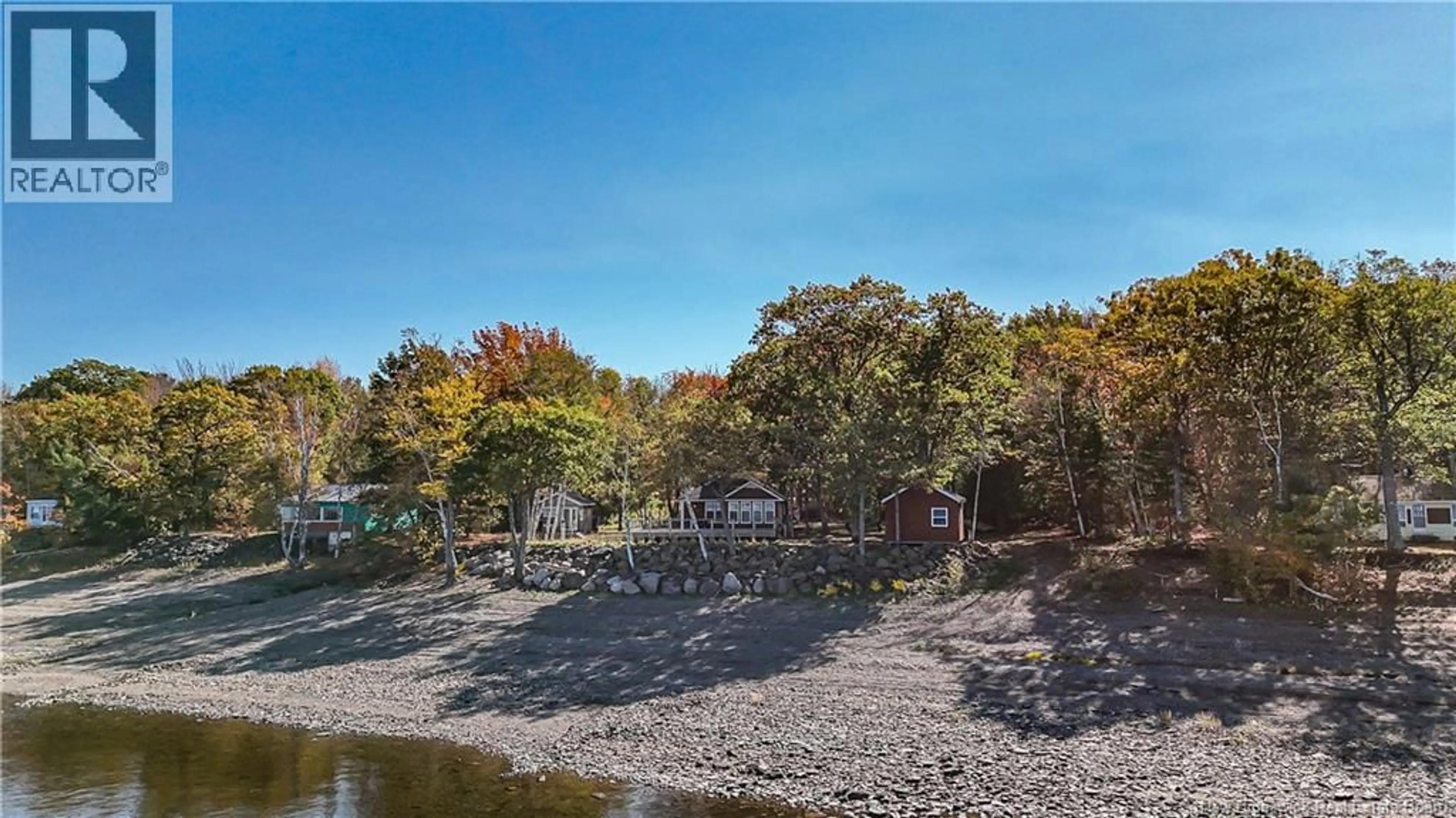 A pic from outside/outdoor area/front of a property/back of a property/a pic from drone, water/lake/river/ocean view for 63 LEWIS ROAD, Grand Lake New Brunswick E4C3V3