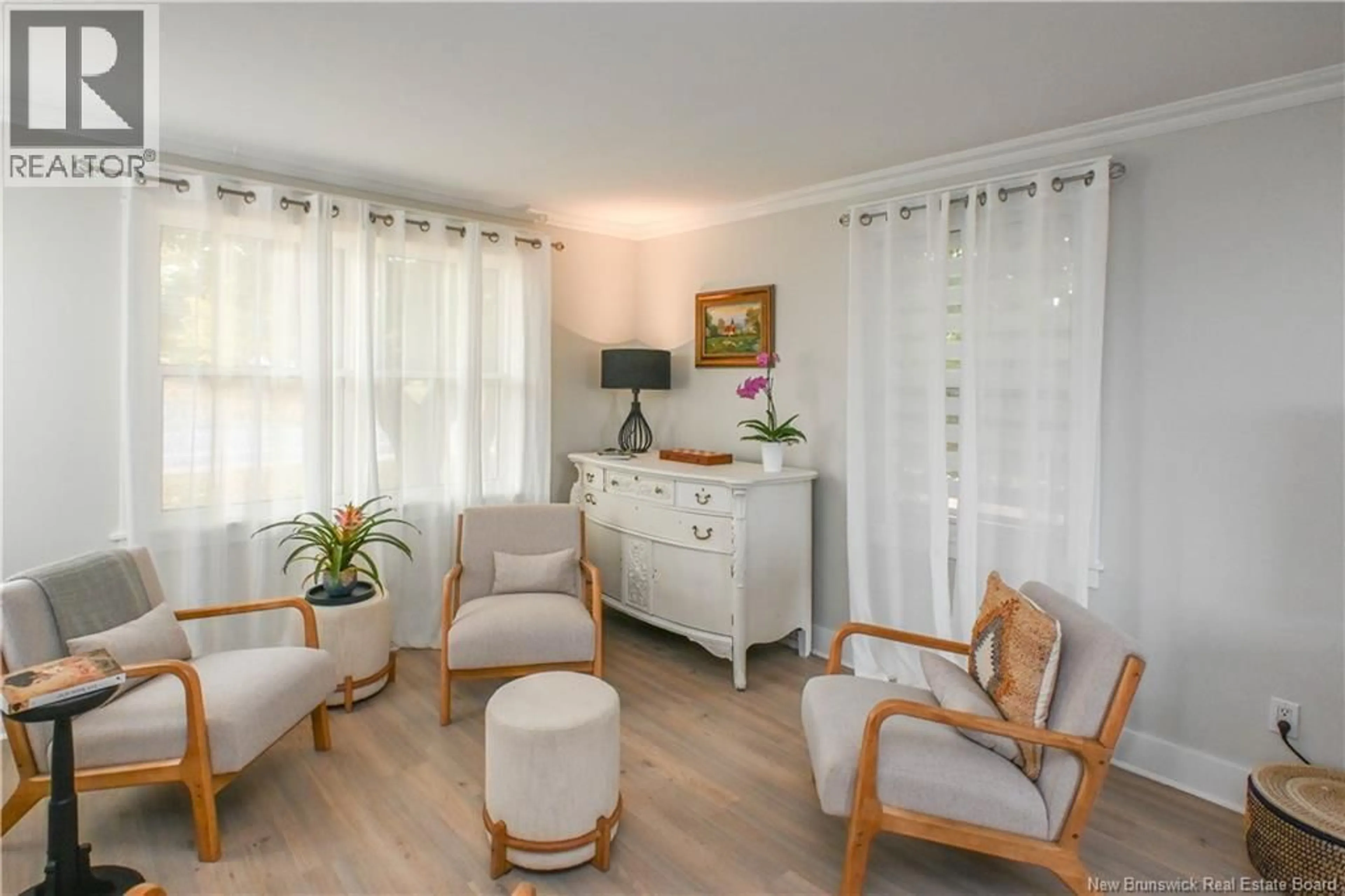 Living room with furniture, wood/laminate floor for 309 SAINT-PIERRE O BOULEVARD, Caraquet New Brunswick E1W1A3