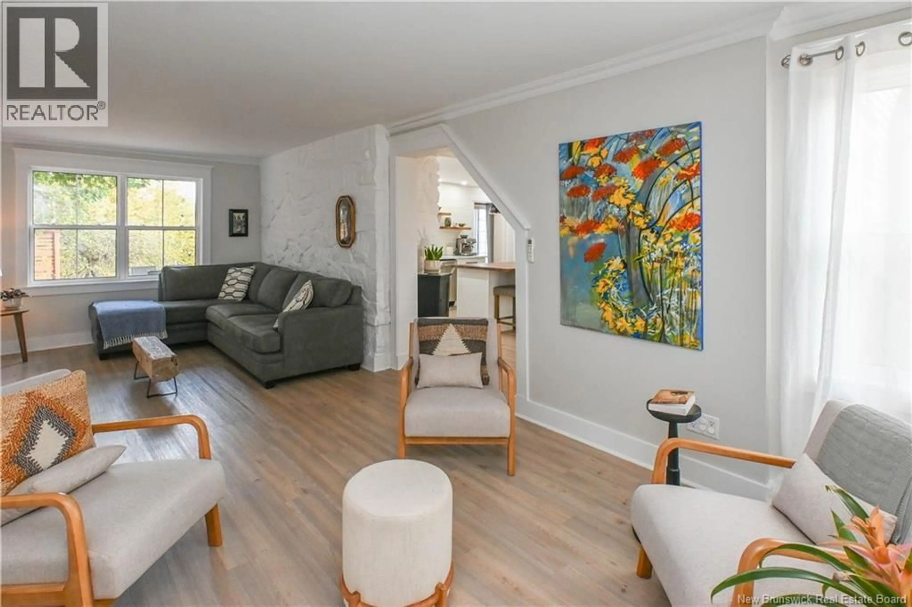 Living room with furniture, wood/laminate floor for 309 SAINT-PIERRE O BOULEVARD, Caraquet New Brunswick E1W1A3