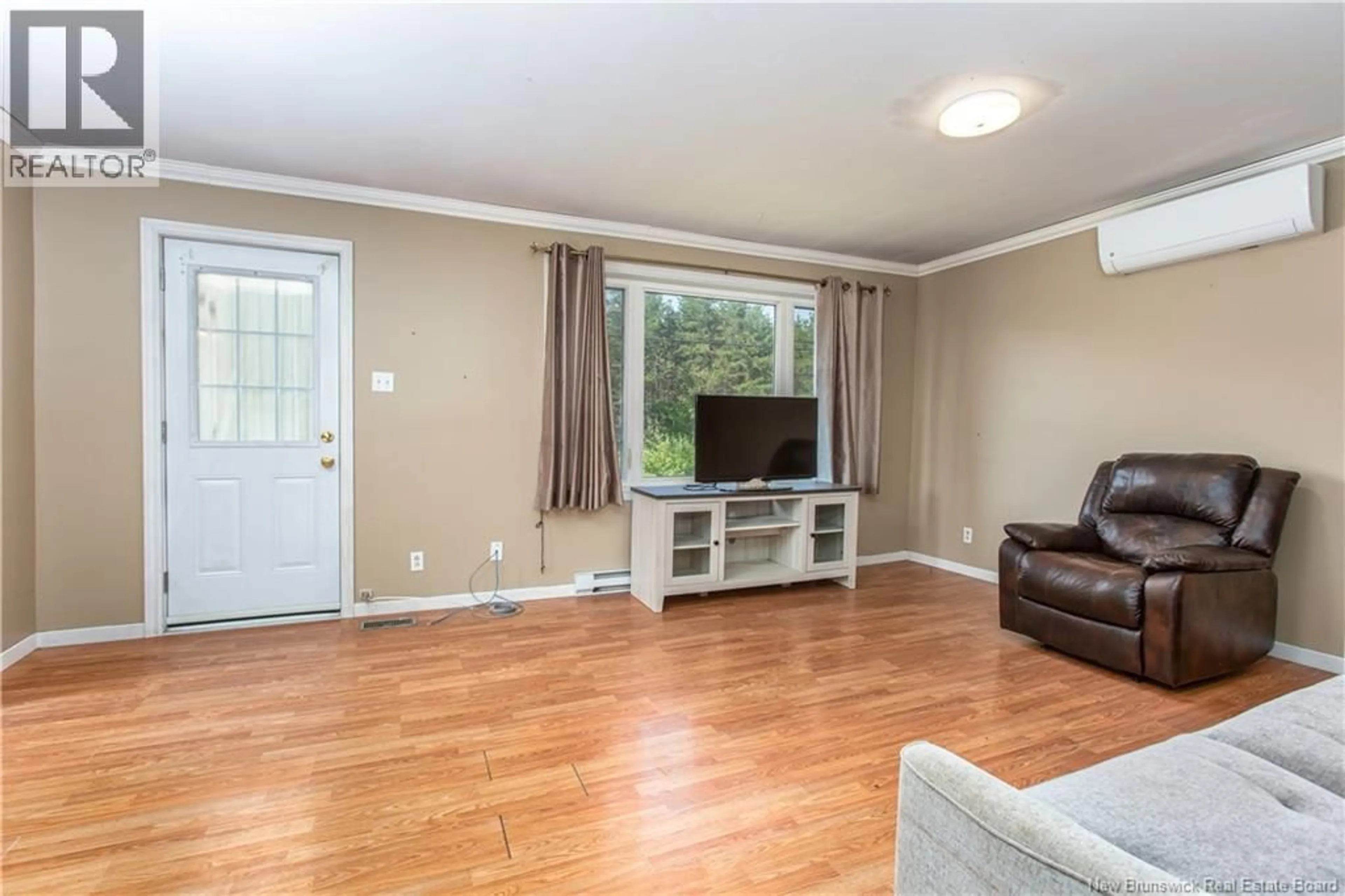 Living room with furniture, wood/laminate floor for 210 PIROGUE, Richibouctou-Village New Brunswick E4W1J8