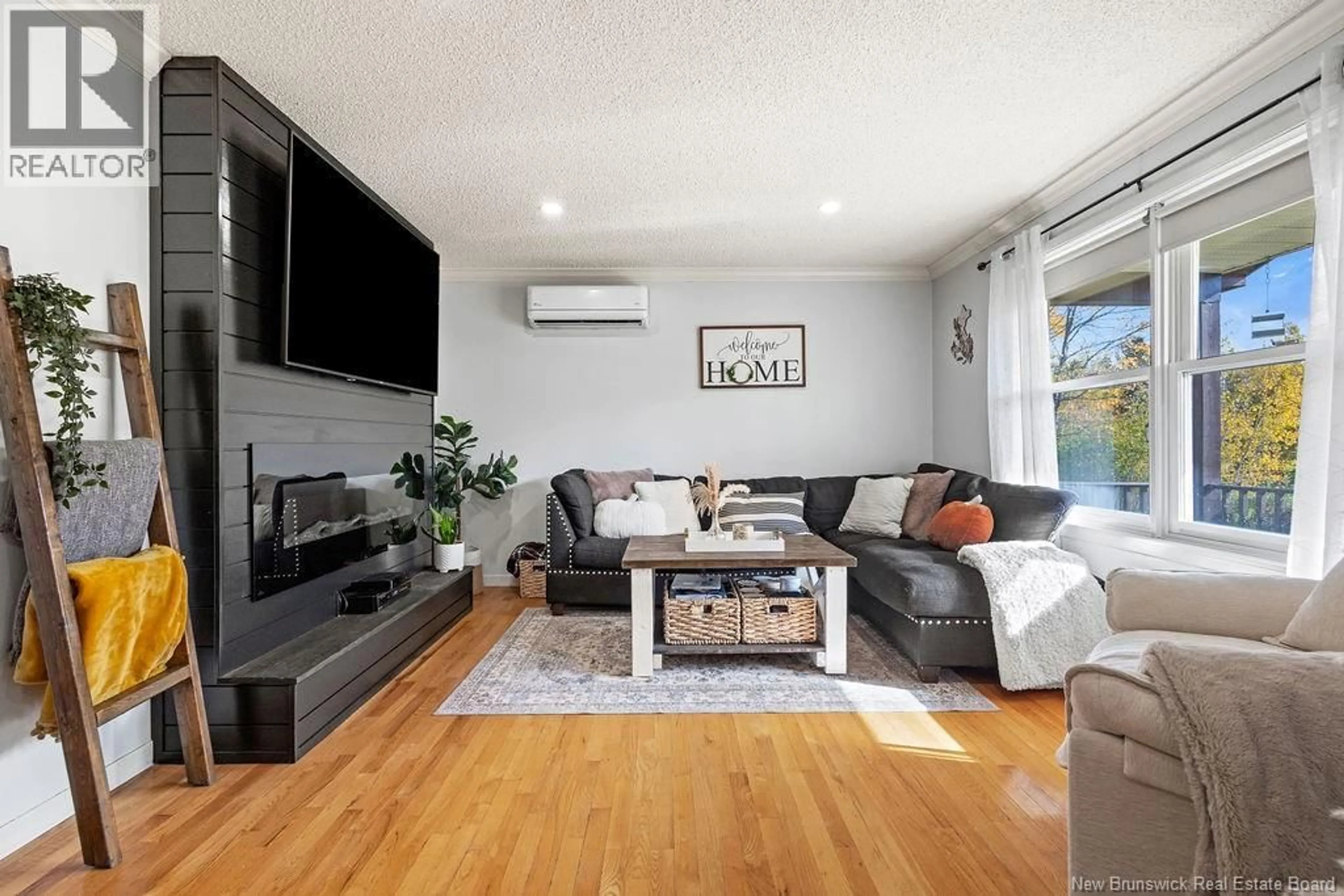 Living room with furniture, wood/laminate floor for 4815 108 ROUTE, Derby New Brunswick E1V5C2