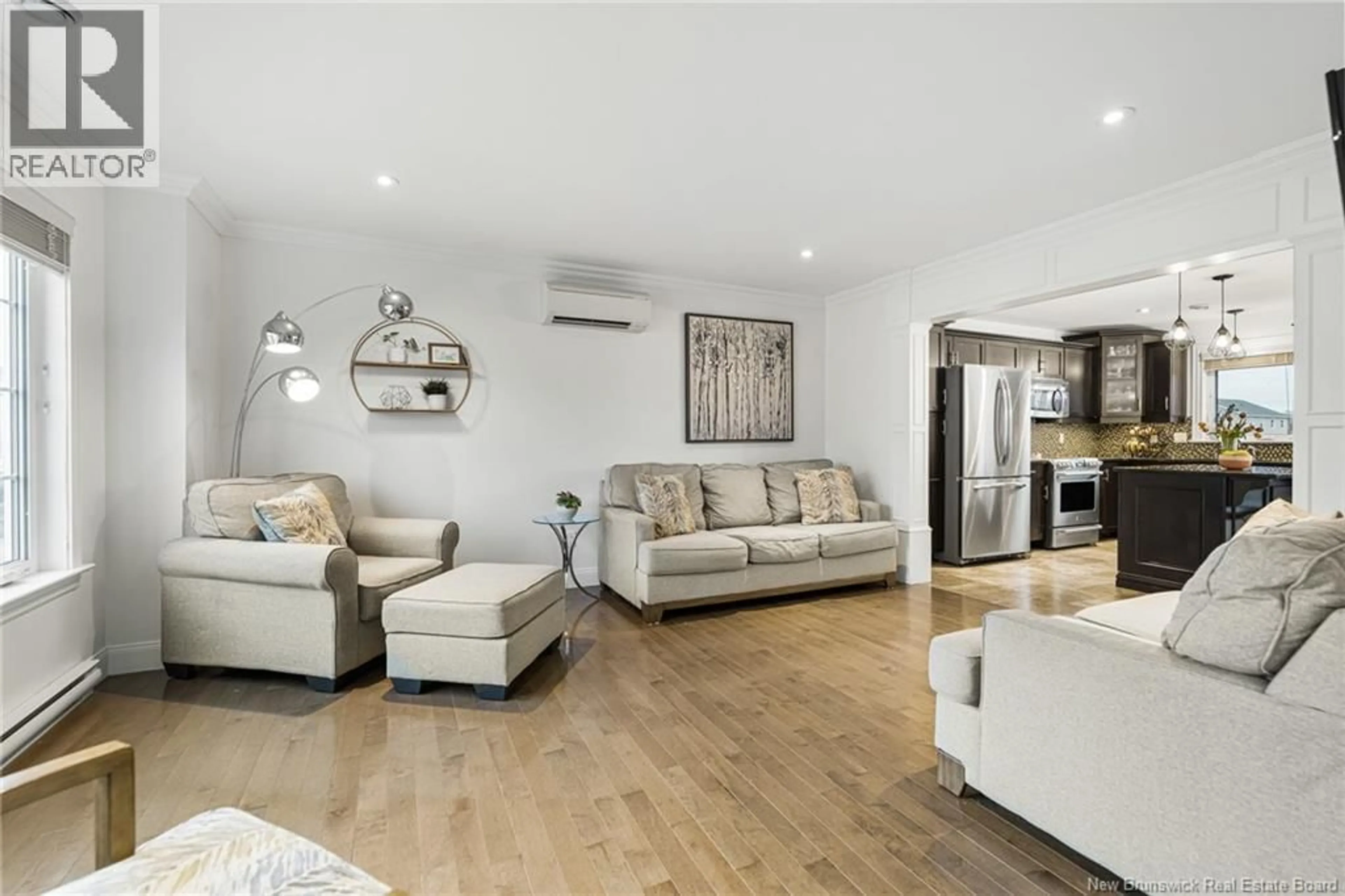Living room with furniture, wood/laminate floor for 112 LAROCHELLE STREET, Dieppe New Brunswick E1A8Y5