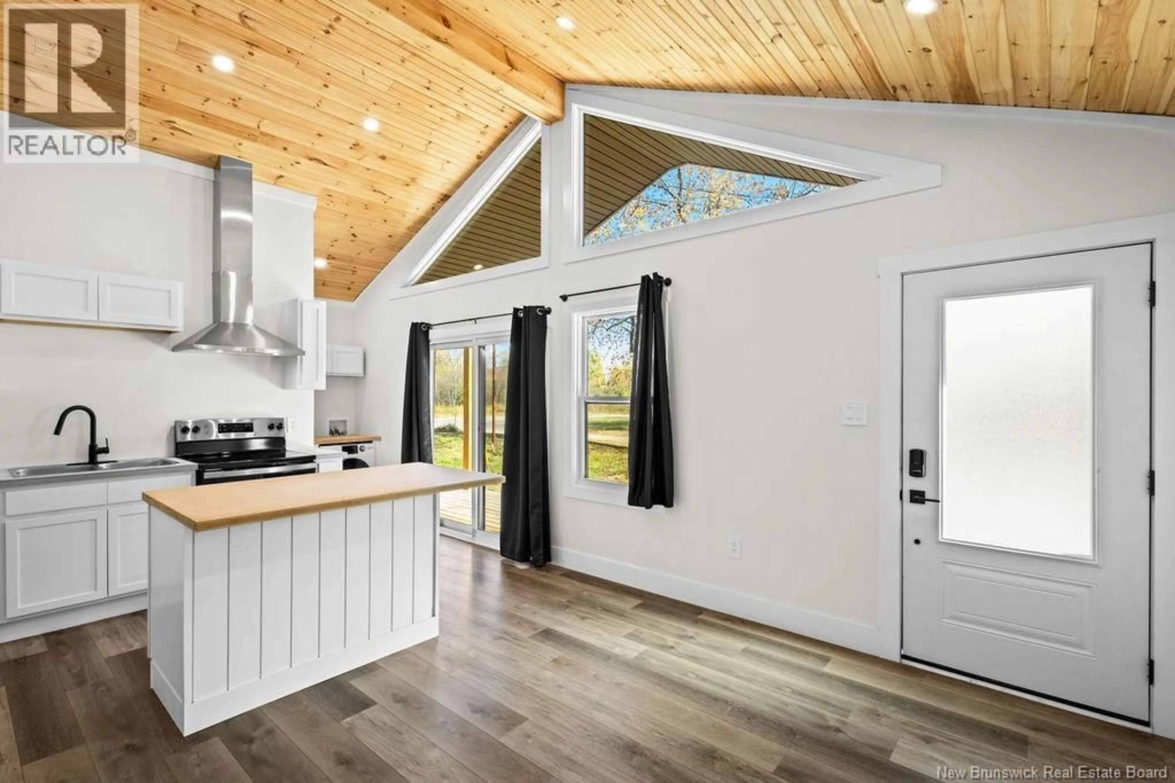 Open concept kitchen, wood/laminate floor for 261 ALLISON LANE, Miramichi New Brunswick E1V3C8