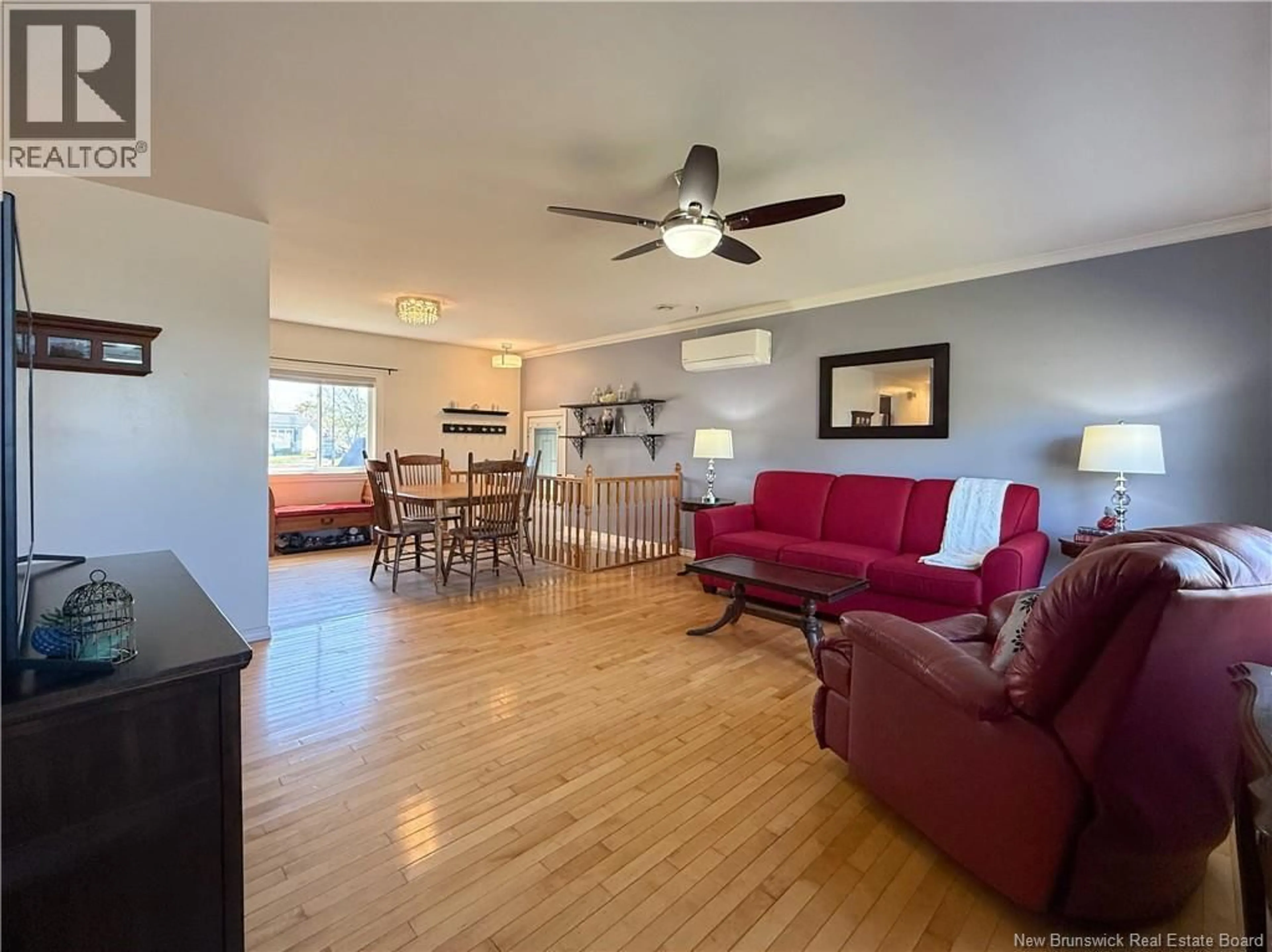 Living room with furniture, wood/laminate floor for 158 BARRIEAU, Moncton New Brunswick E1G1J8