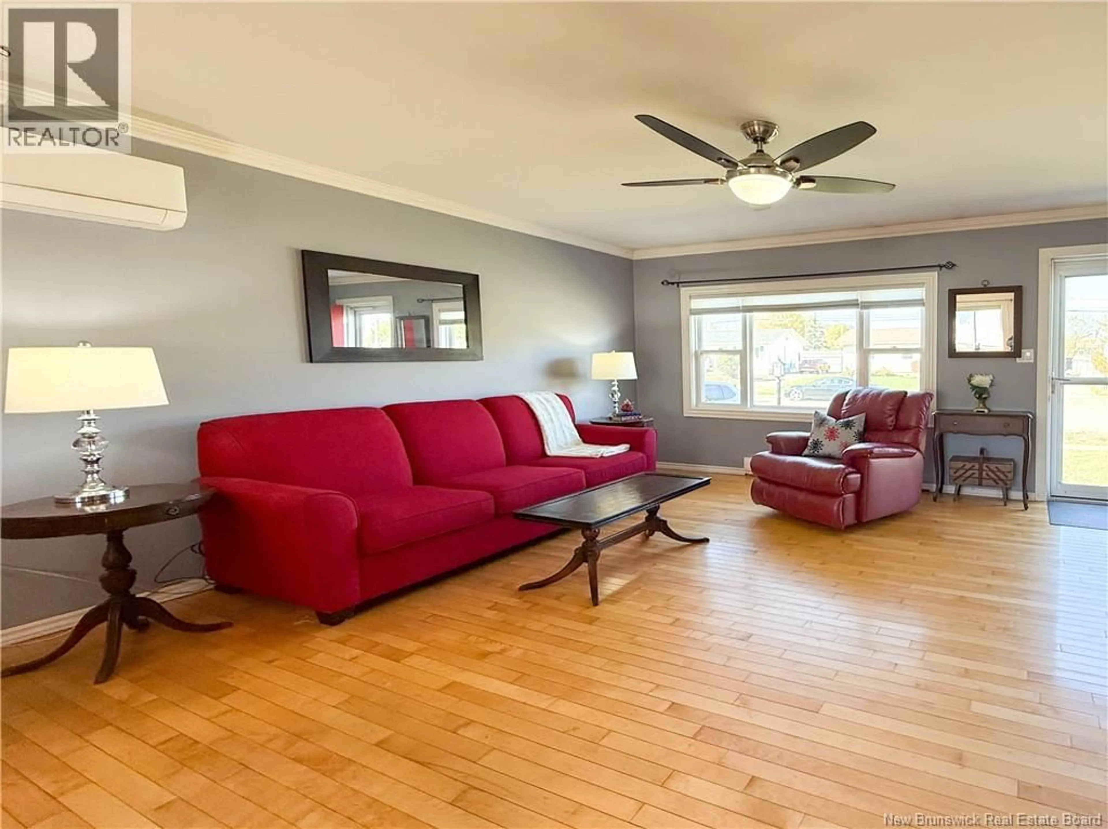 Living room with furniture, wood/laminate floor for 158 BARRIEAU, Moncton New Brunswick E1G1J8