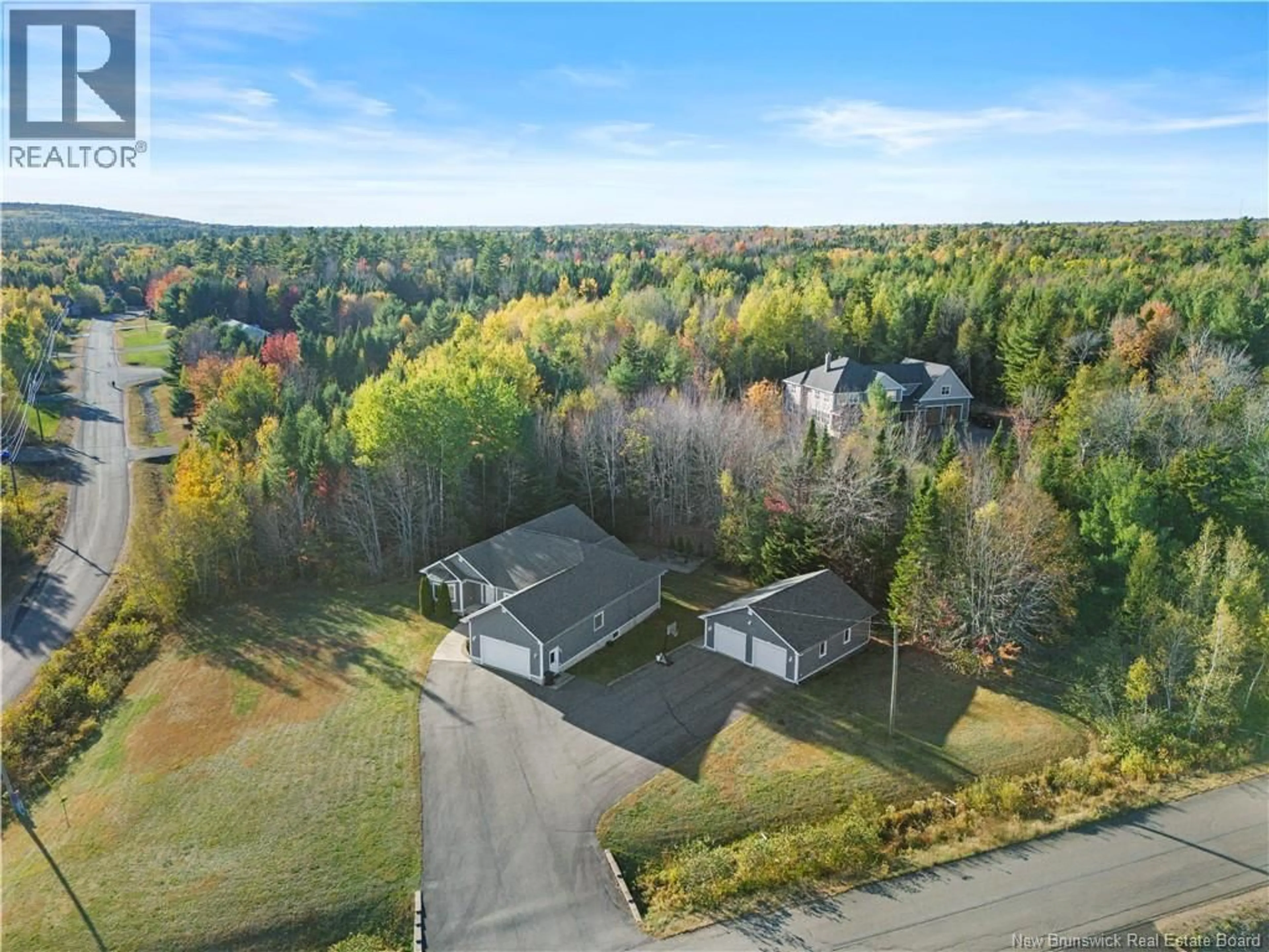 A pic from outside/outdoor area/front of a property/back of a property/a pic from drone, unknown for 7 STARLING CRESCENT, Hanwell New Brunswick E3E2P8