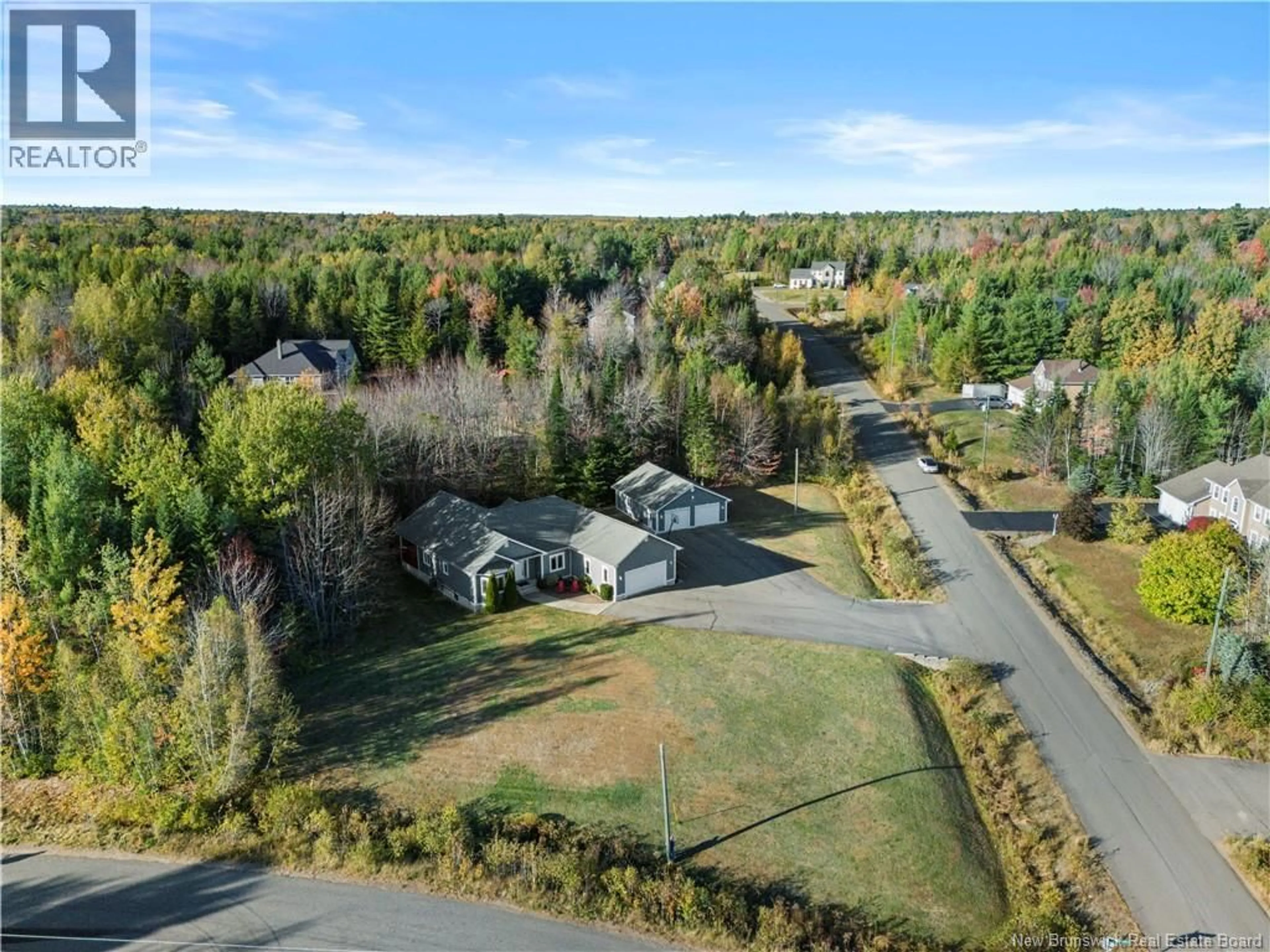 A pic from outside/outdoor area/front of a property/back of a property/a pic from drone, unknown for 7 STARLING CRESCENT, Hanwell New Brunswick E3E2P8