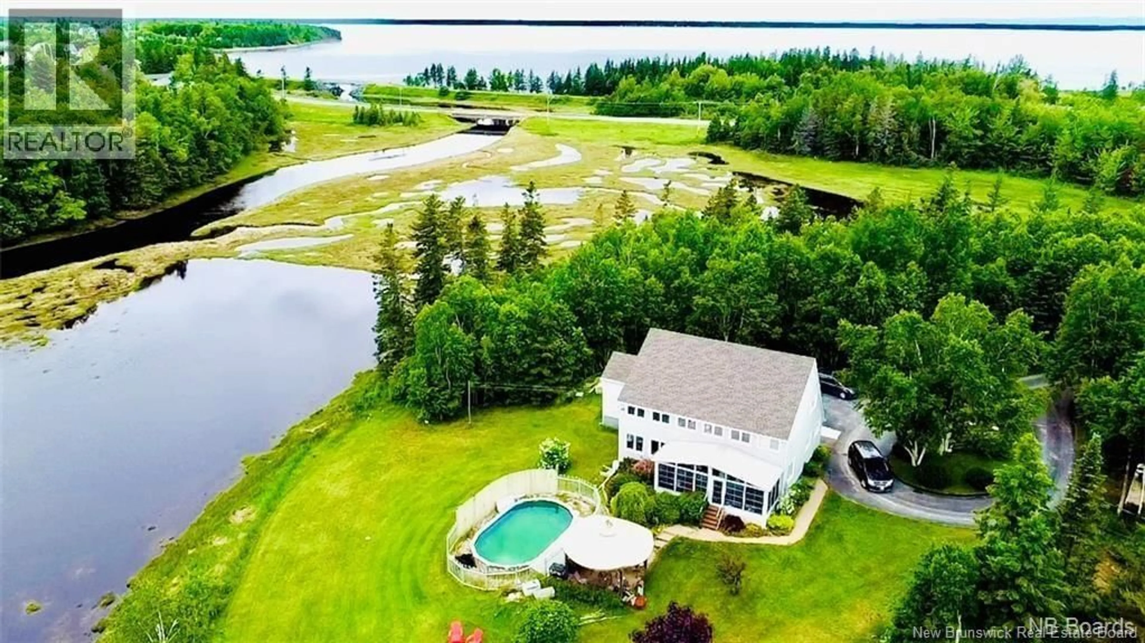 A pic from outside/outdoor area/front of a property/back of a property/a pic from drone, water/lake/river/ocean view for 490A ST PIERRE OUEST BOULEVARD, Caraquet New Brunswick E1W1A3