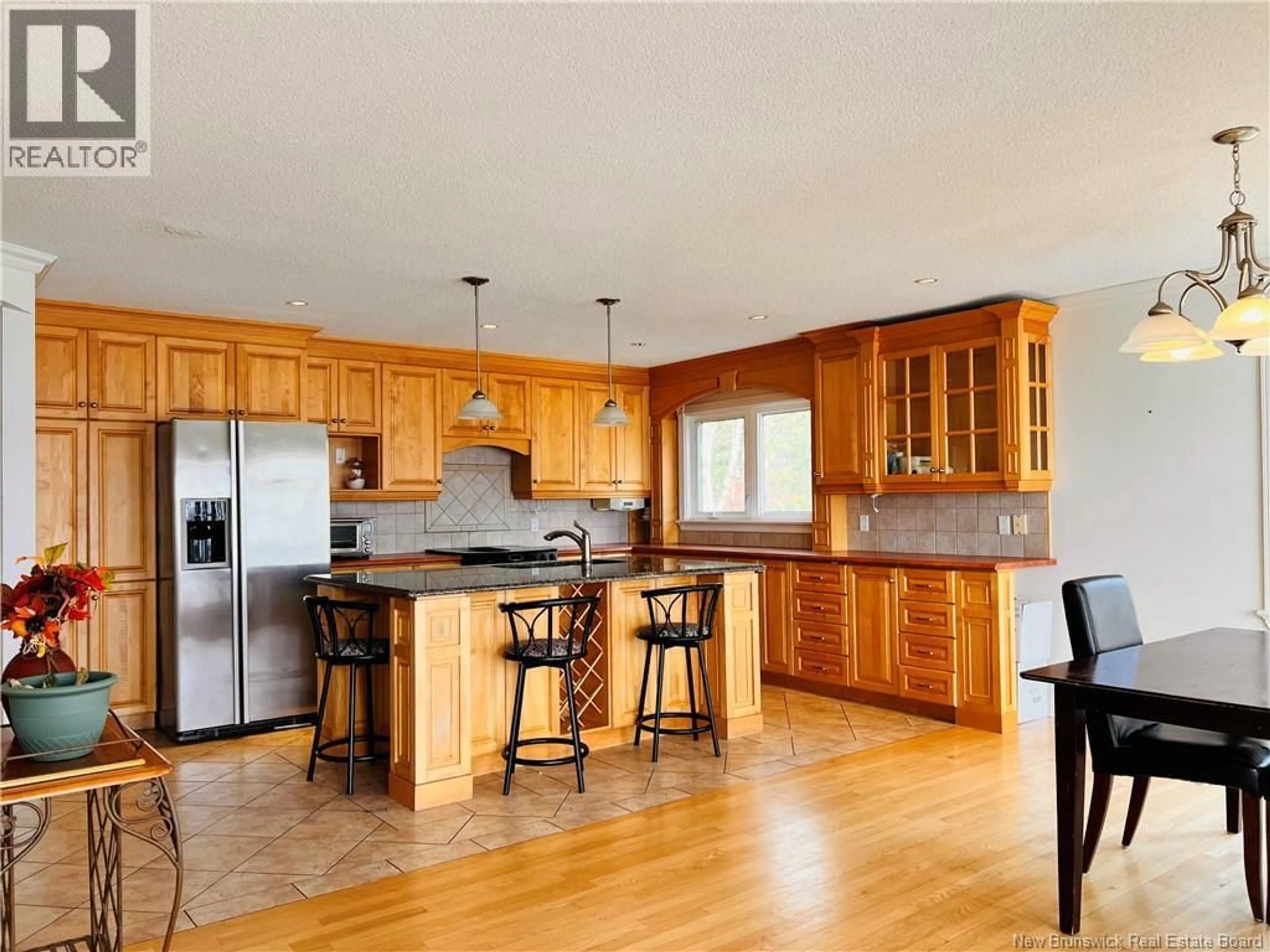 Open concept kitchen, wood/laminate floor for 490A ST PIERRE OUEST BOULEVARD, Caraquet New Brunswick E1W1A3