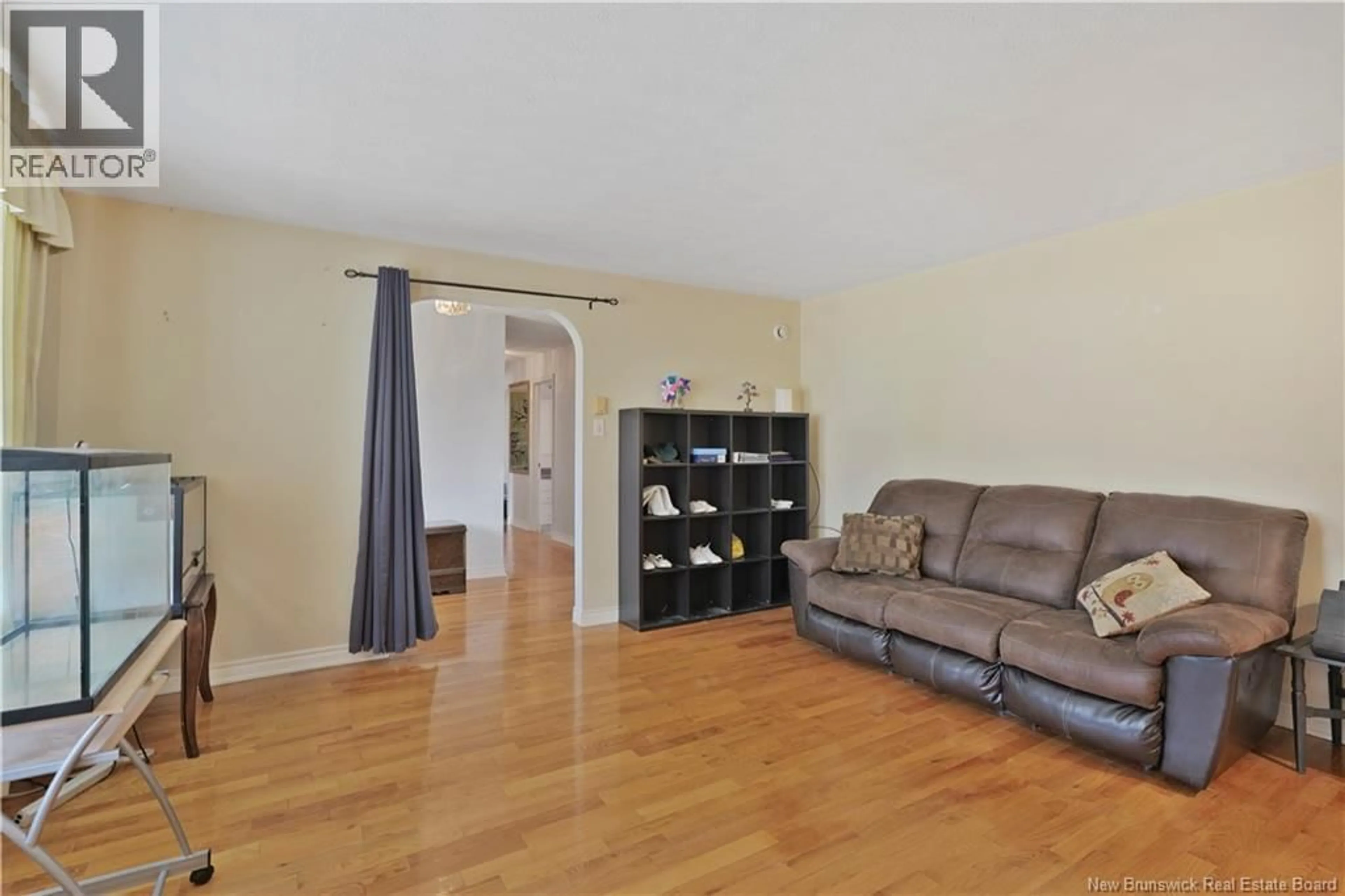 Living room with furniture, wood/laminate floor for 116 SPRUCEWOOD DRIVE, New Maryland New Brunswick E3C1C5