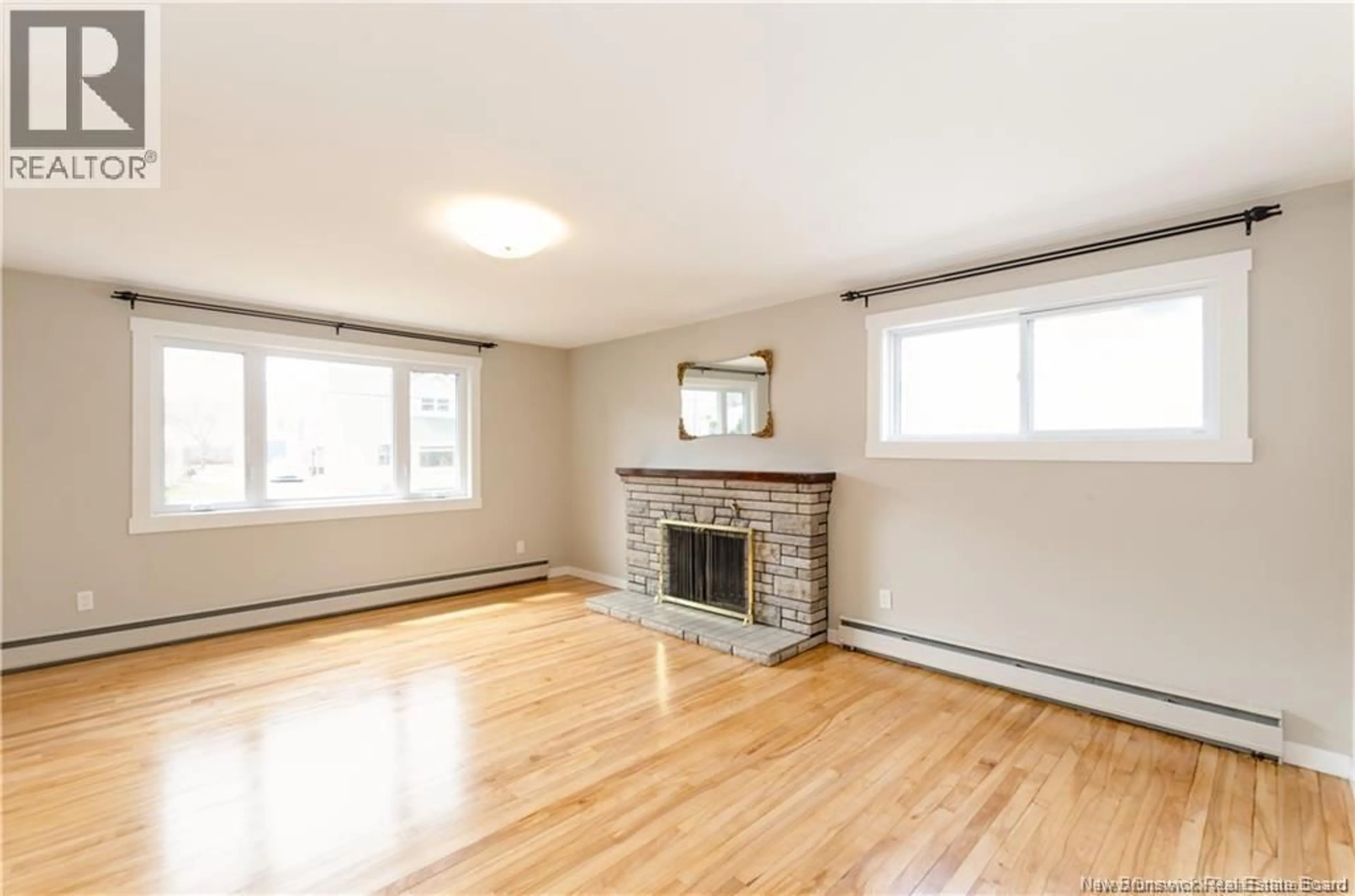 Living room with furniture, wood/laminate floor for 93 EDWARD, Moncton New Brunswick E1A3Z1