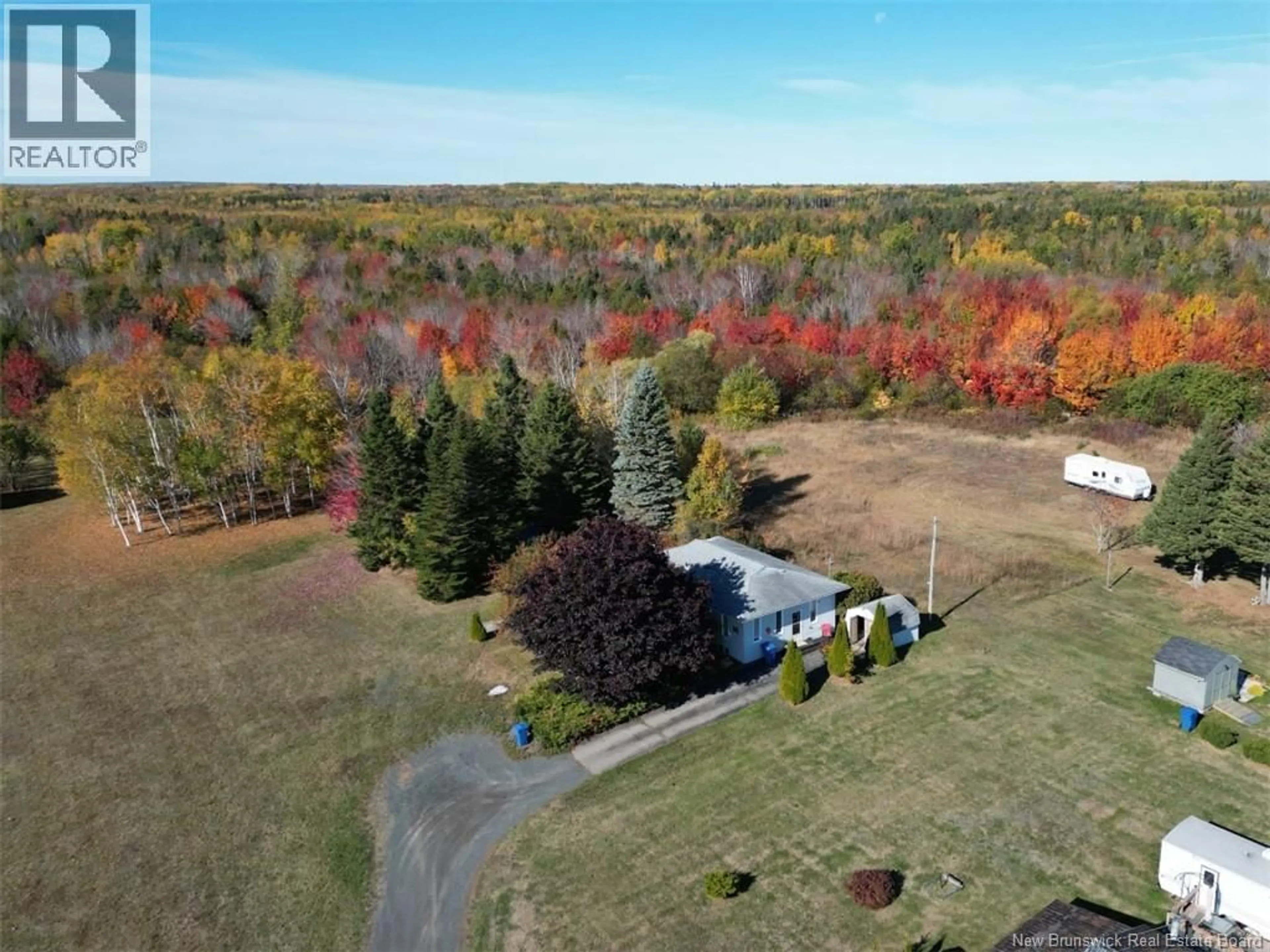 A pic from outside/outdoor area/front of a property/back of a property/a pic from drone, forest/trees view for 564 PRINCIPALE, Beresford New Brunswick E8K2A8
