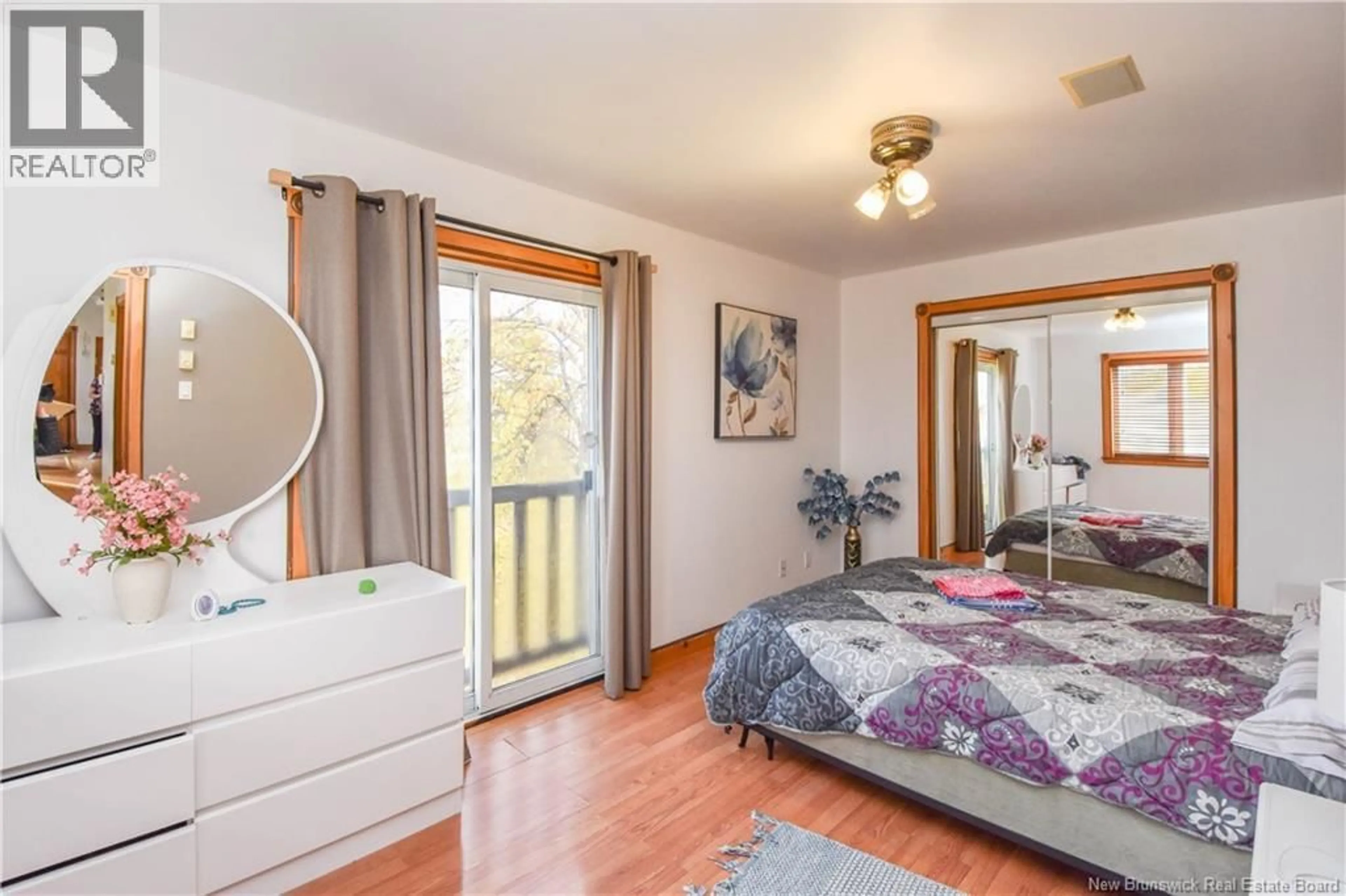 Bedroom with bed, wood/laminate floor for 373 COUGHLAN STREET, Tracadie New Brunswick E1X1B3