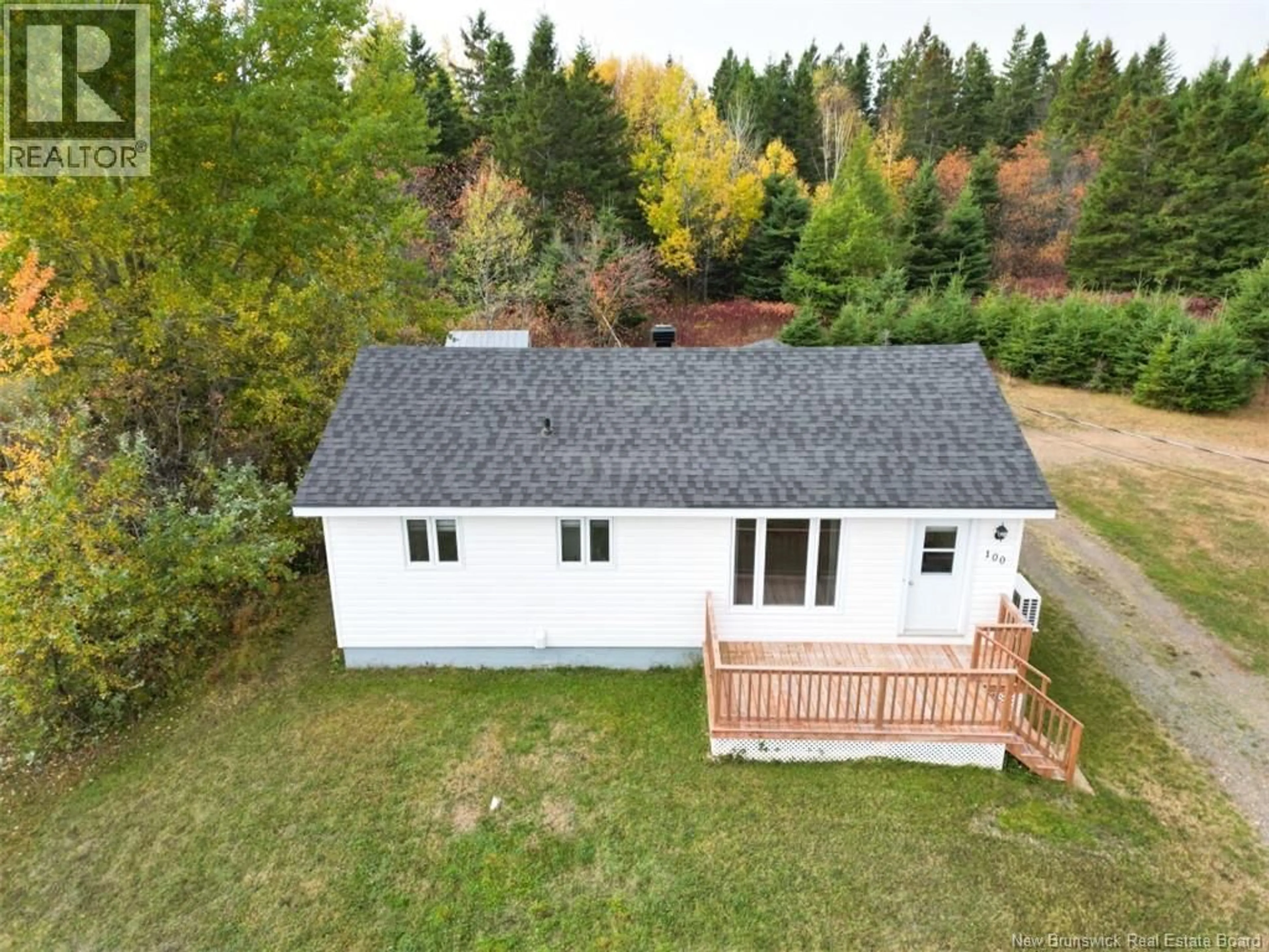 A pic from outside/outdoor area/front of a property/back of a property/a pic from drone, forest/trees view for 100 PRINCIPALE, Pointe-Verte New Brunswick E8J2W3