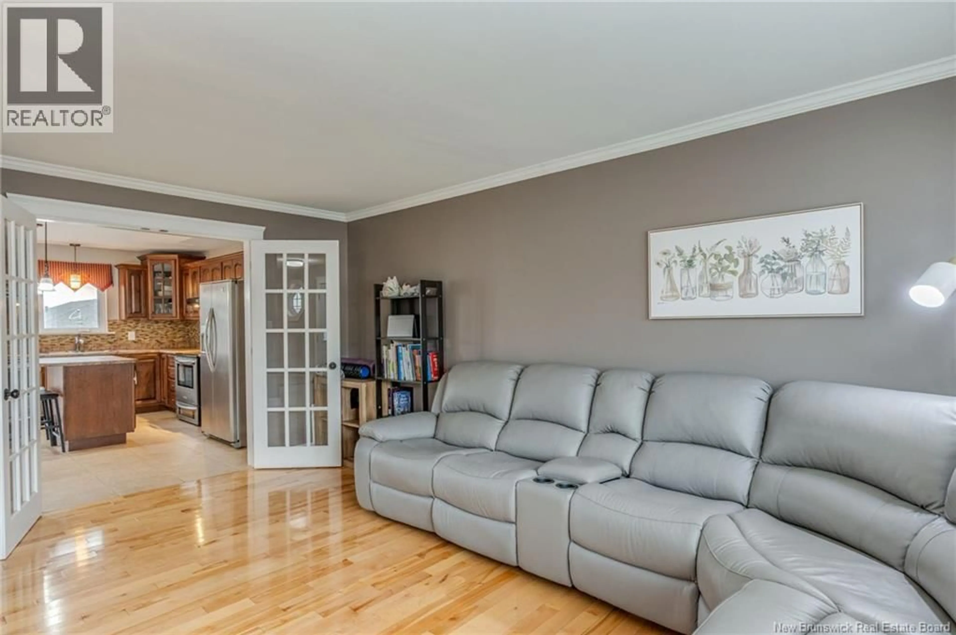 Living room with furniture, wood/laminate floor for 88 STILLWATER DRIVE, Moncton New Brunswick E1E0C6