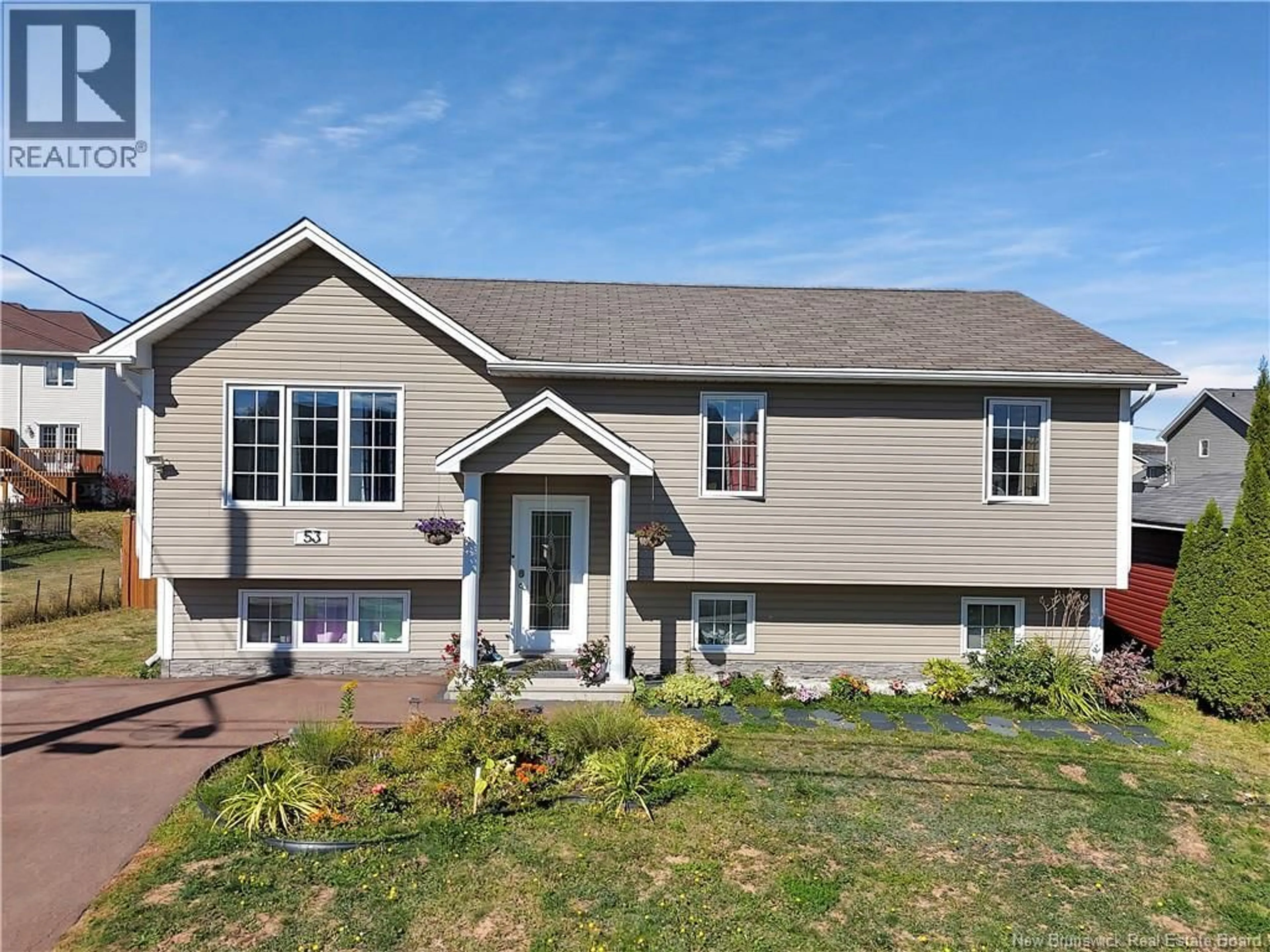 Home with vinyl exterior material, street for 53 FALCON DRIVE, Moncton New Brunswick E1G0H8