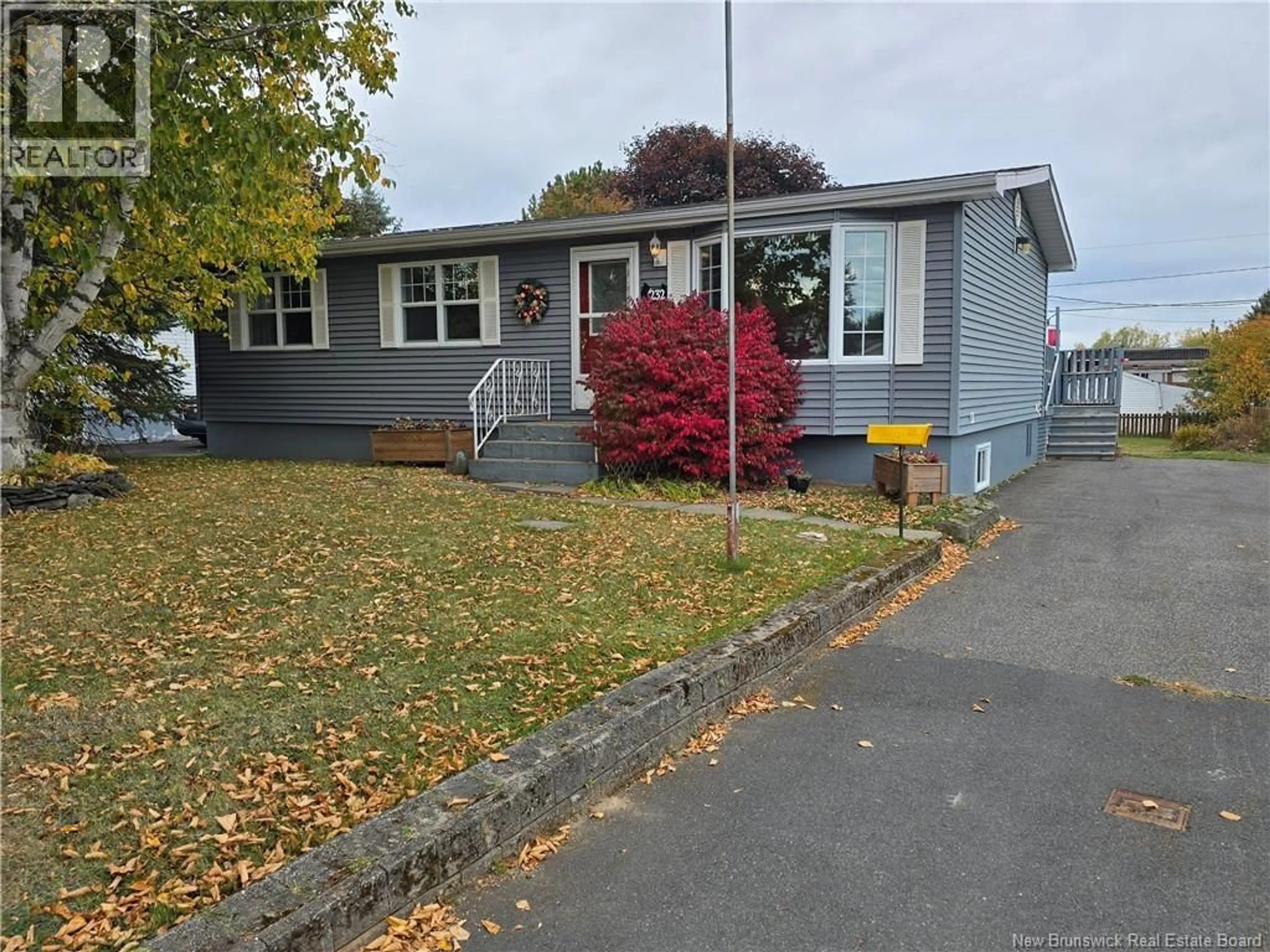 Home with vinyl exterior material, street for 232 AIMEE STREET, Beresford New Brunswick E8K1L9
