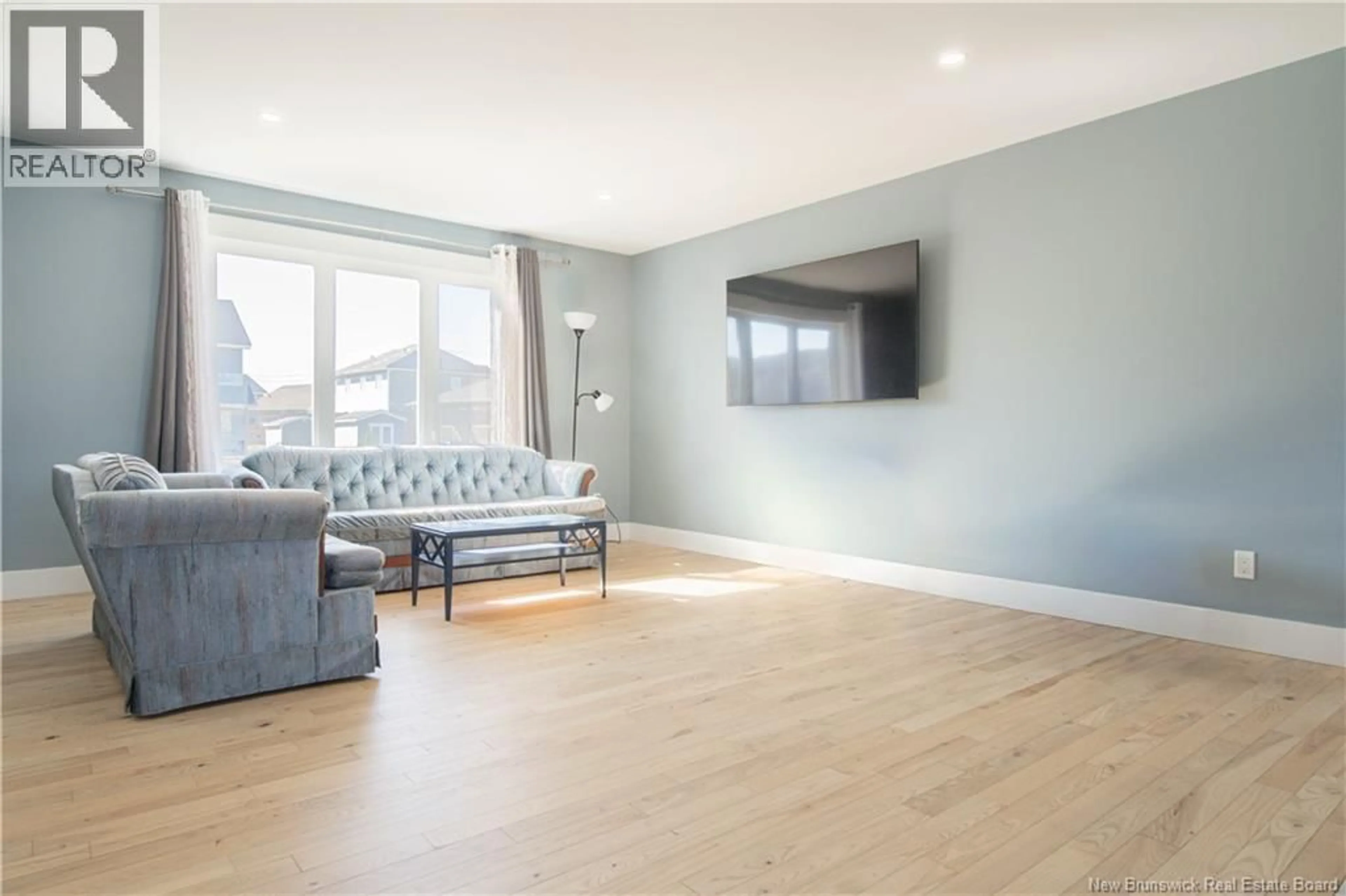 Living room with furniture, wood/laminate floor for 175 OAKFIELD DRIVE, Riverview New Brunswick E1B0W6