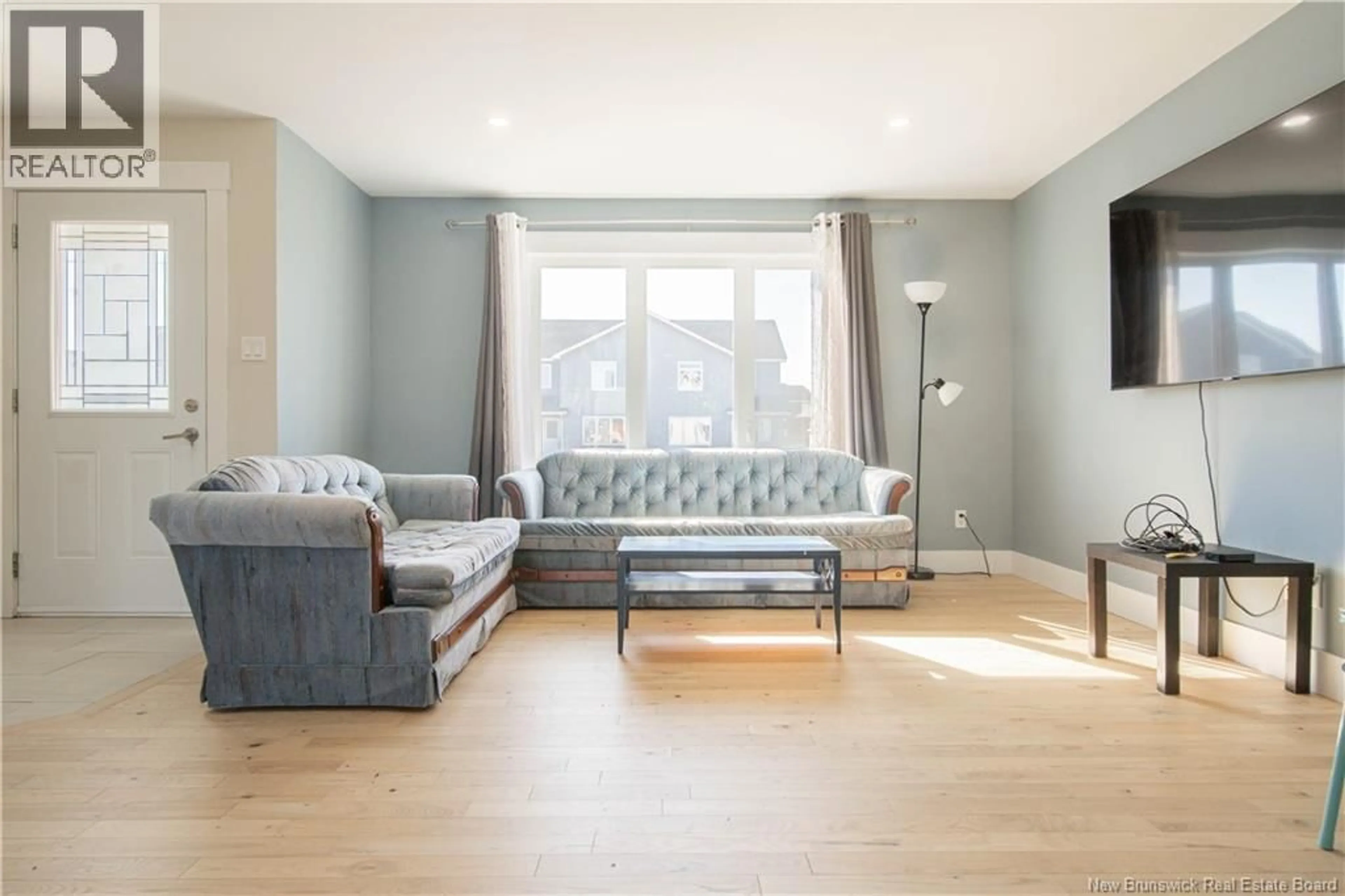 Living room with furniture, wood/laminate floor for 175 OAKFIELD DRIVE, Riverview New Brunswick E1B0W6