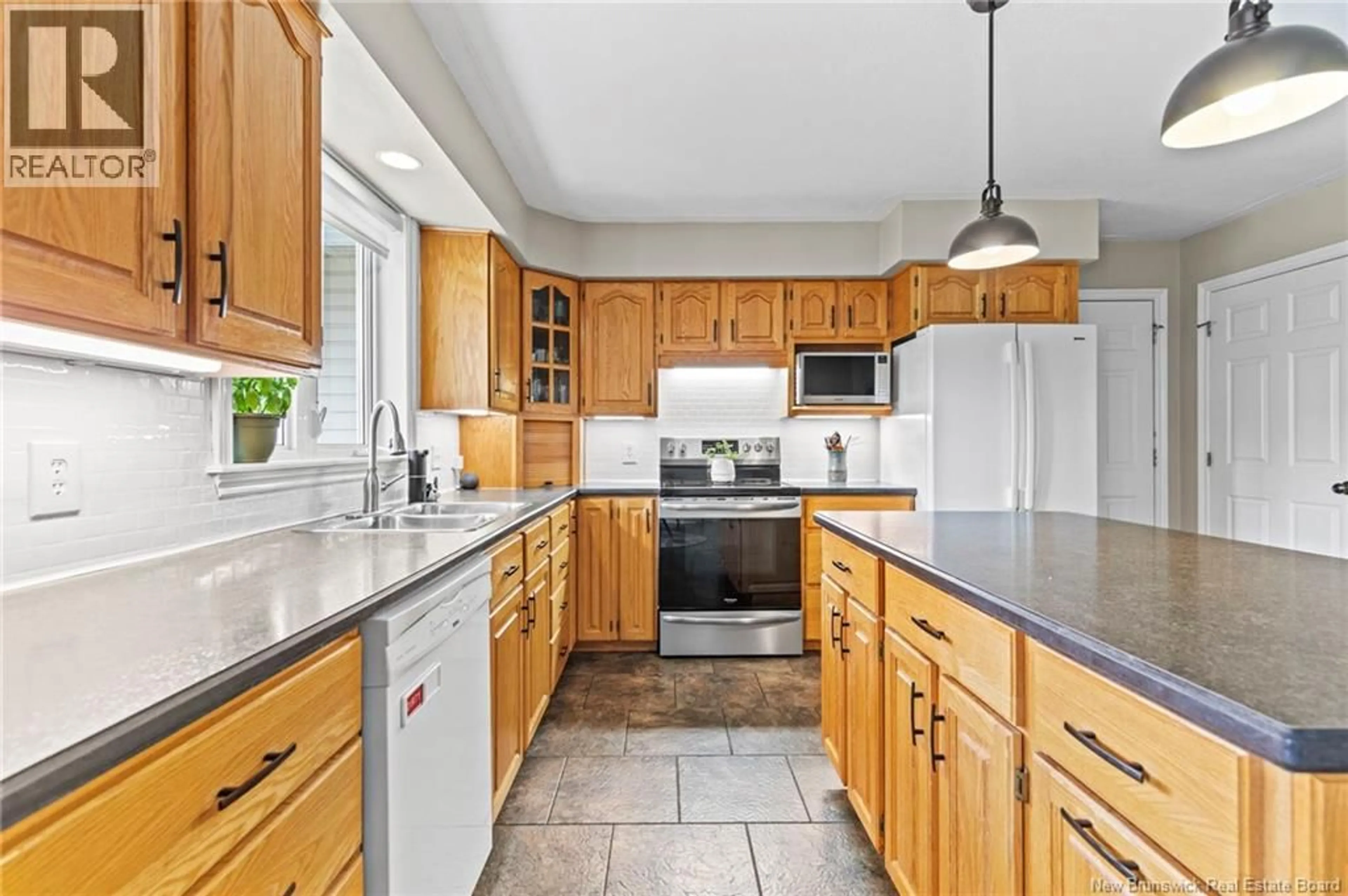 Open concept kitchen, ceramic/tile floor for 45 MARS LANE, Hanwell New Brunswick E3C1M9