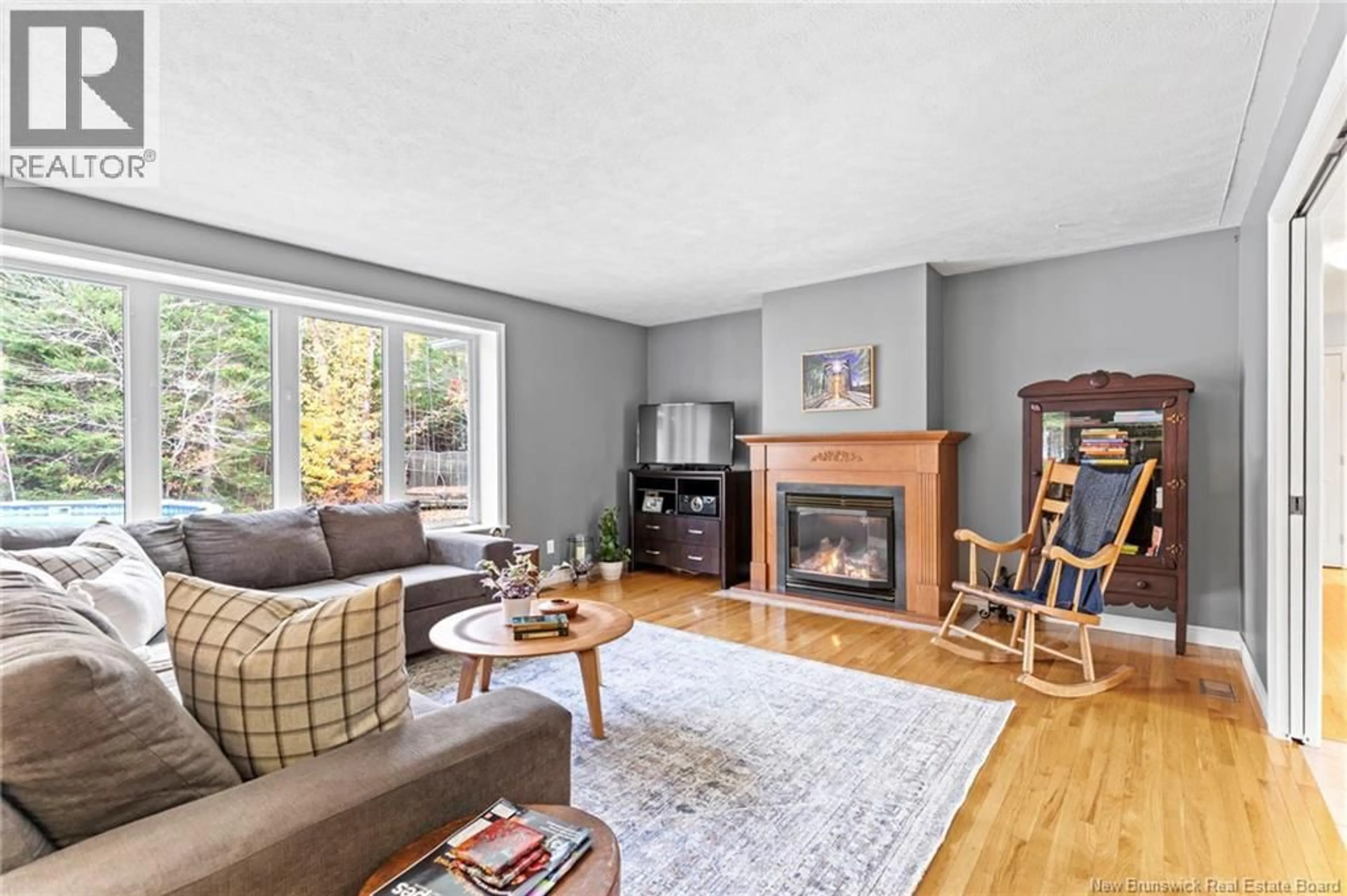 Living room with furniture, wood/laminate floor for 45 MARS LANE, Hanwell New Brunswick E3C1M9