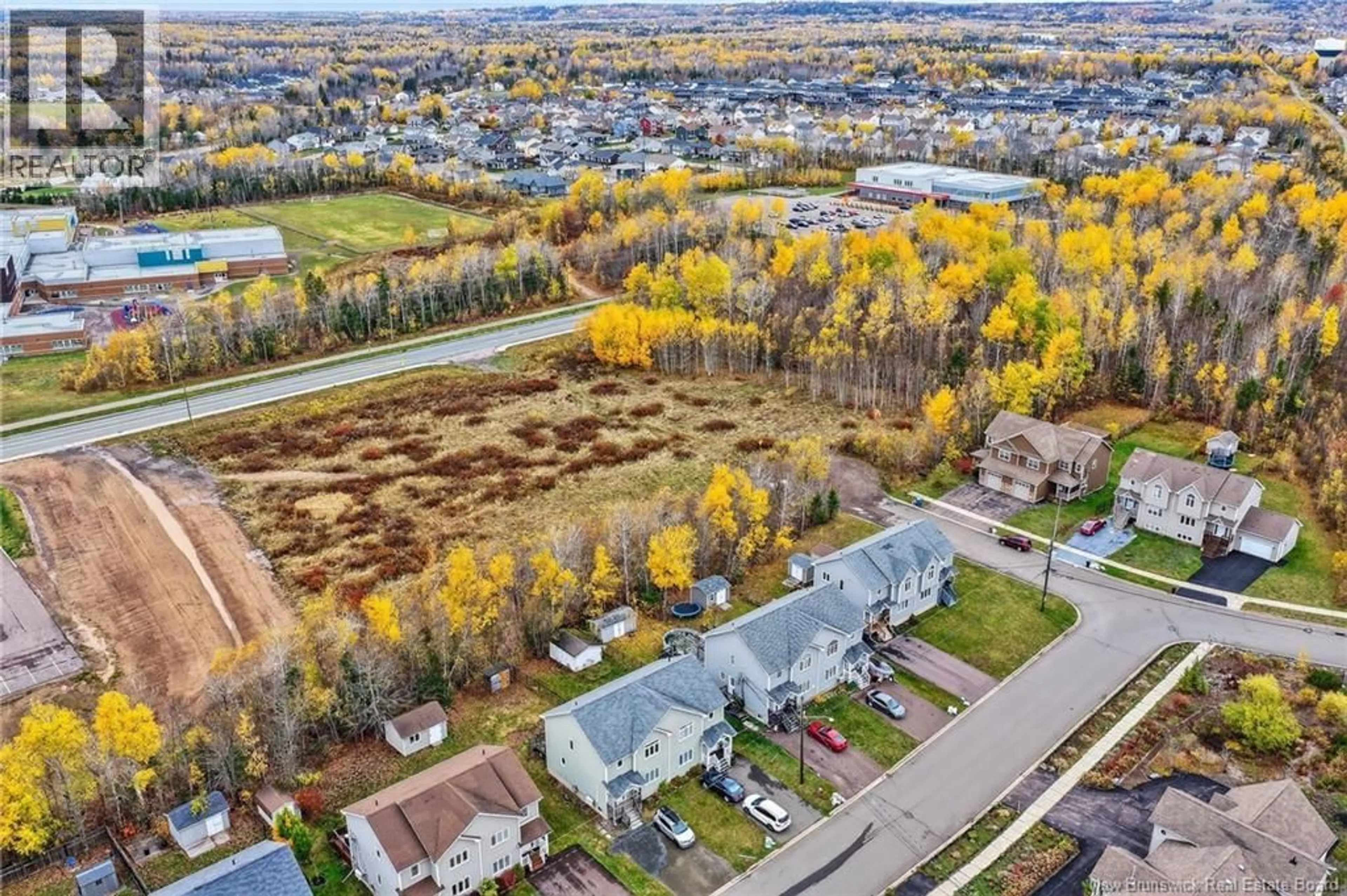 A pic from outside/outdoor area/front of a property/back of a property/a pic from drone, water/lake/river/ocean view for 70 WHISPERWOOD DRIVE, Moncton New Brunswick E1G0P8