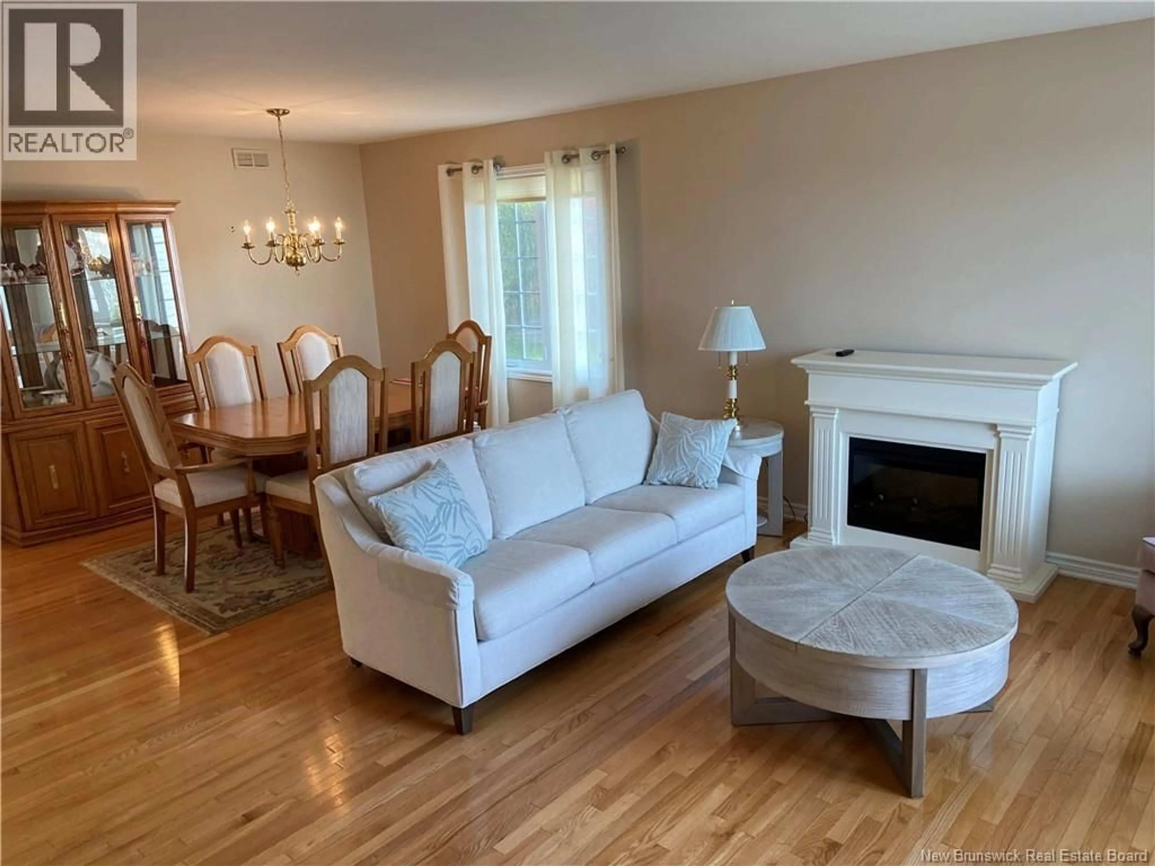 Living room with furniture, wood/laminate floor for 7 WHITE HOUSE COURT, Saint John New Brunswick E2M5Z8