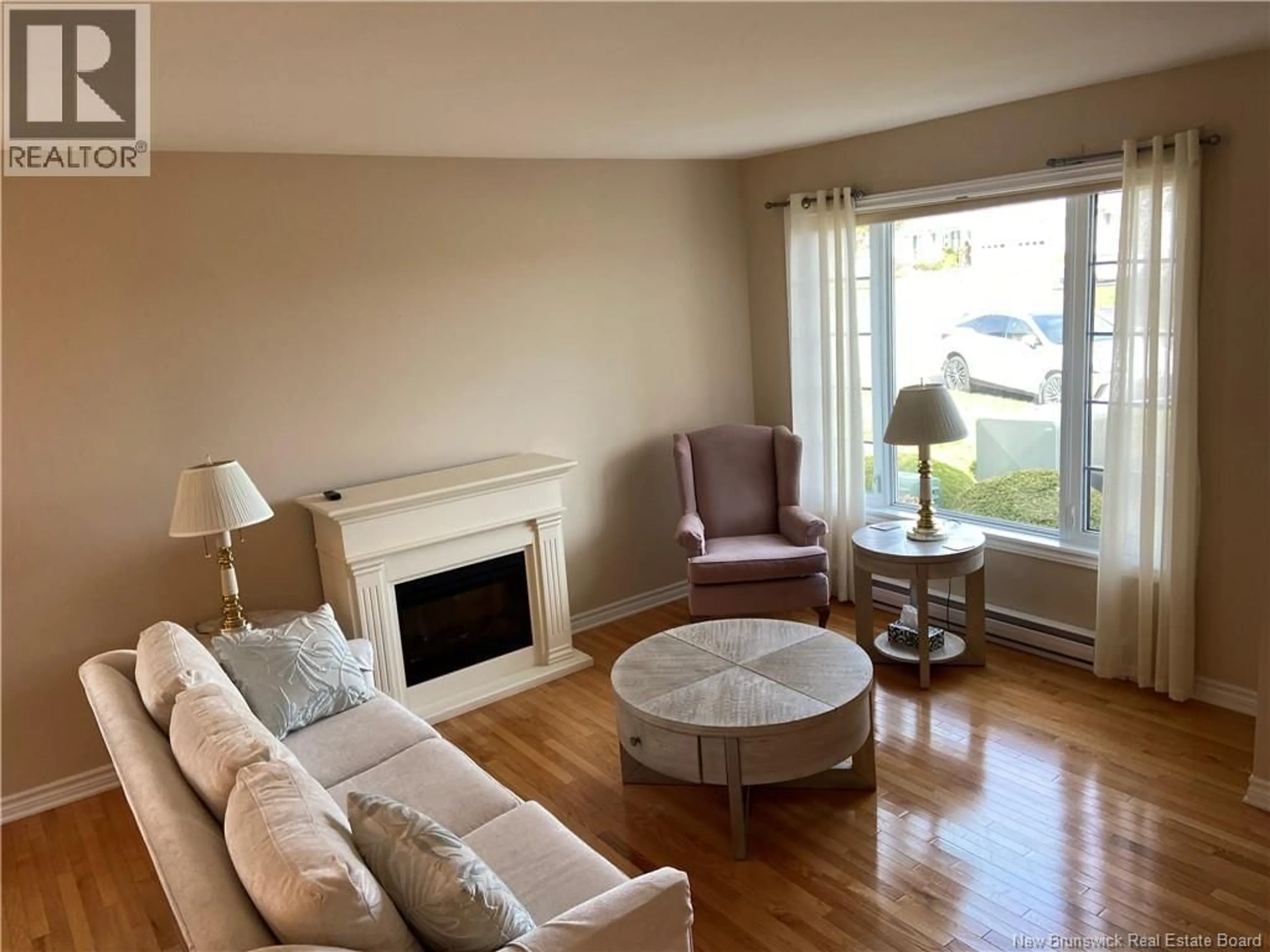 Living room with furniture, wood/laminate floor for 7 WHITE HOUSE COURT, Saint John New Brunswick E2M5Z8