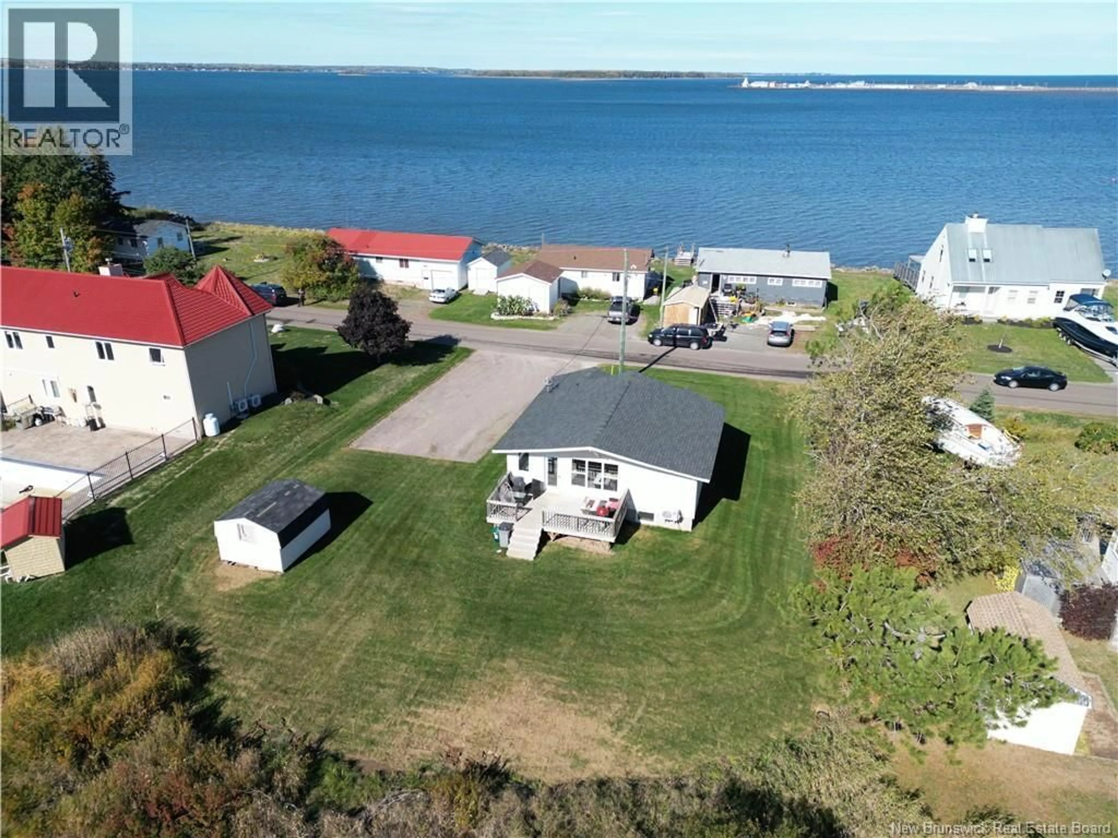 A pic from outside/outdoor area/front of a property/back of a property/a pic from drone, water/lake/river/ocean view for 443 PATUREL, Shediac New Brunswick E4P2L2