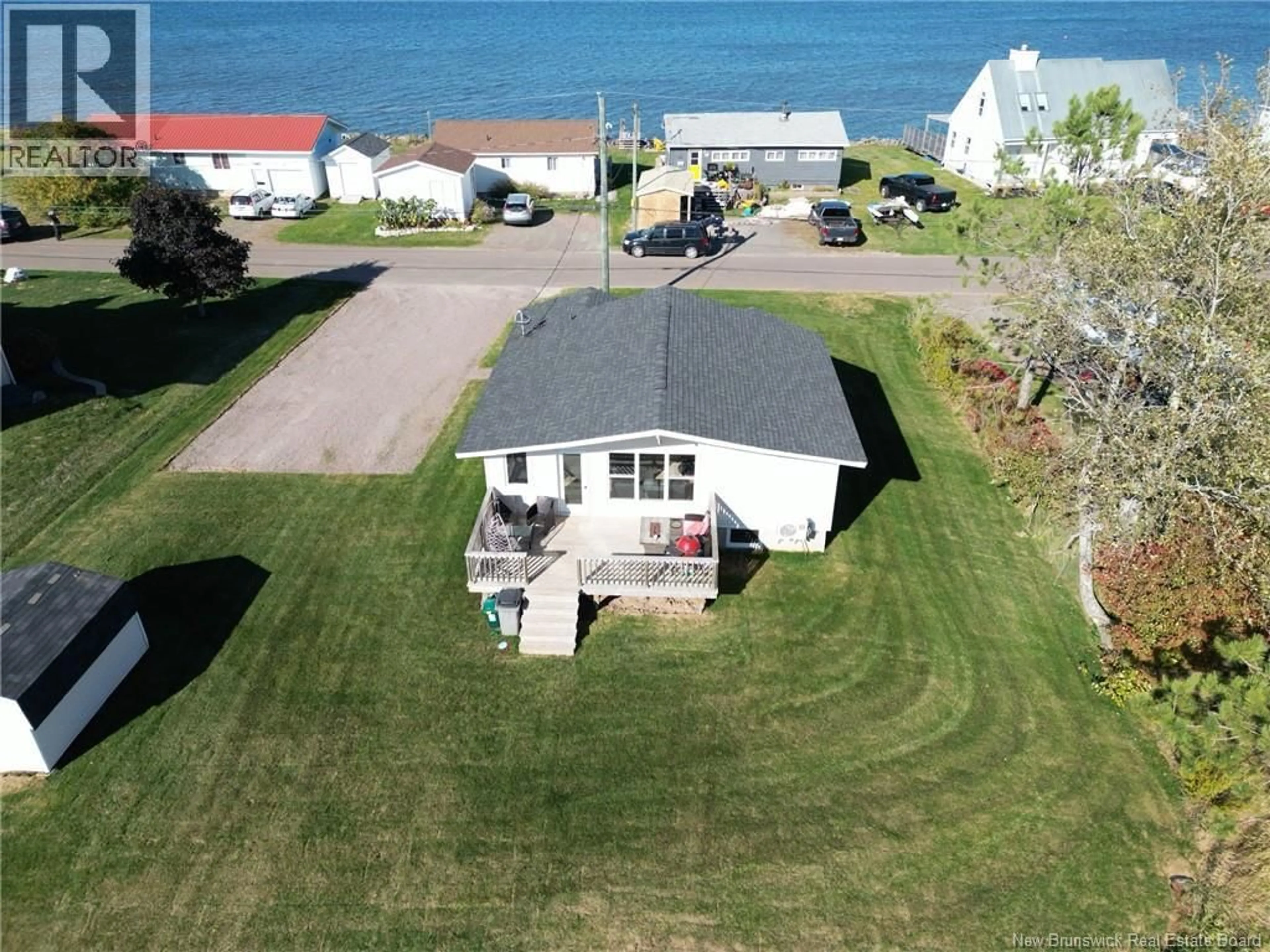 A pic from outside/outdoor area/front of a property/back of a property/a pic from drone, water/lake/river/ocean view for 443 PATUREL, Shediac New Brunswick E4P2L2