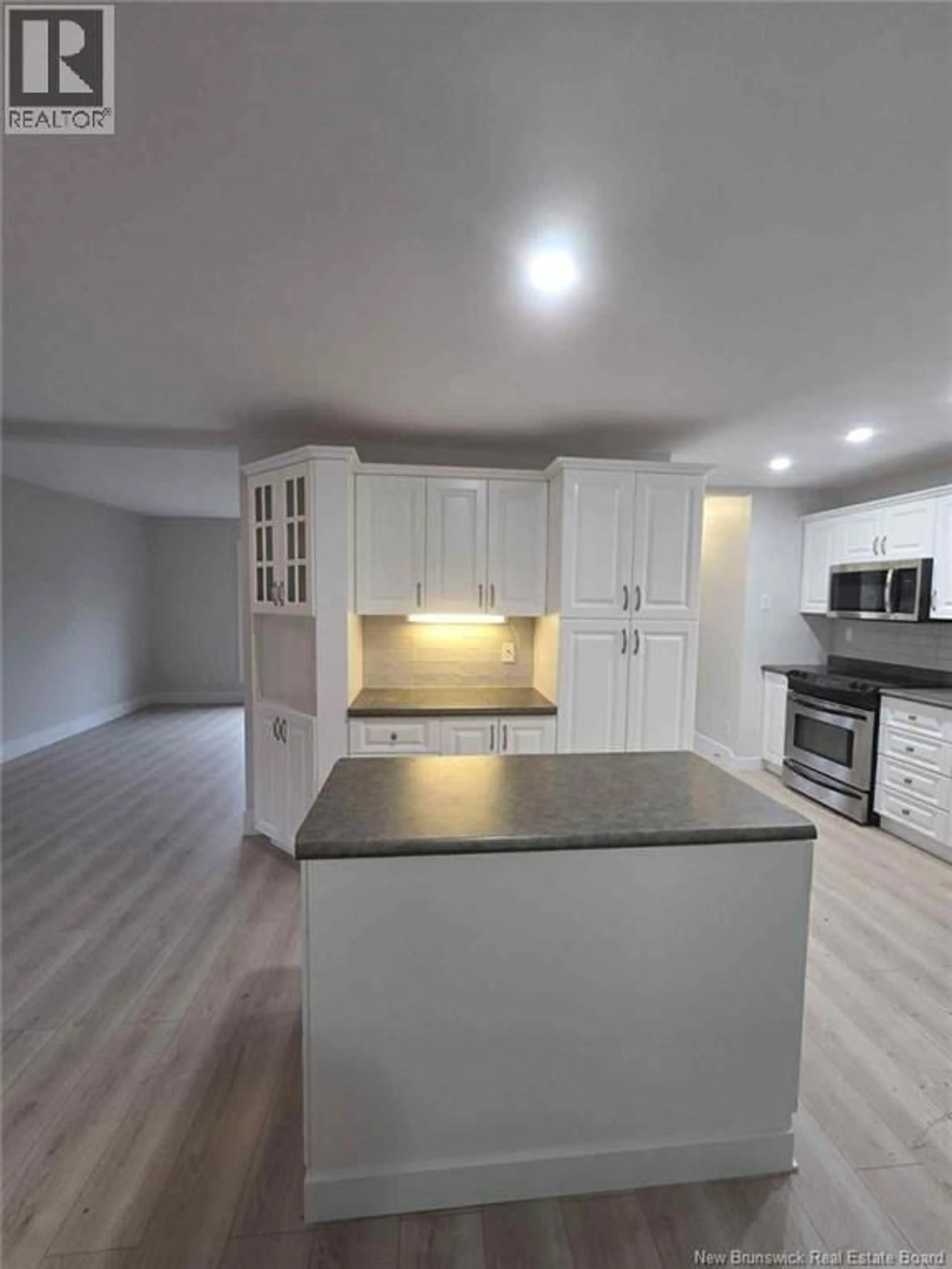 Open concept kitchen, wood/laminate floor for 946 MEADOW AVENUE, Bathurst New Brunswick E2A2H6